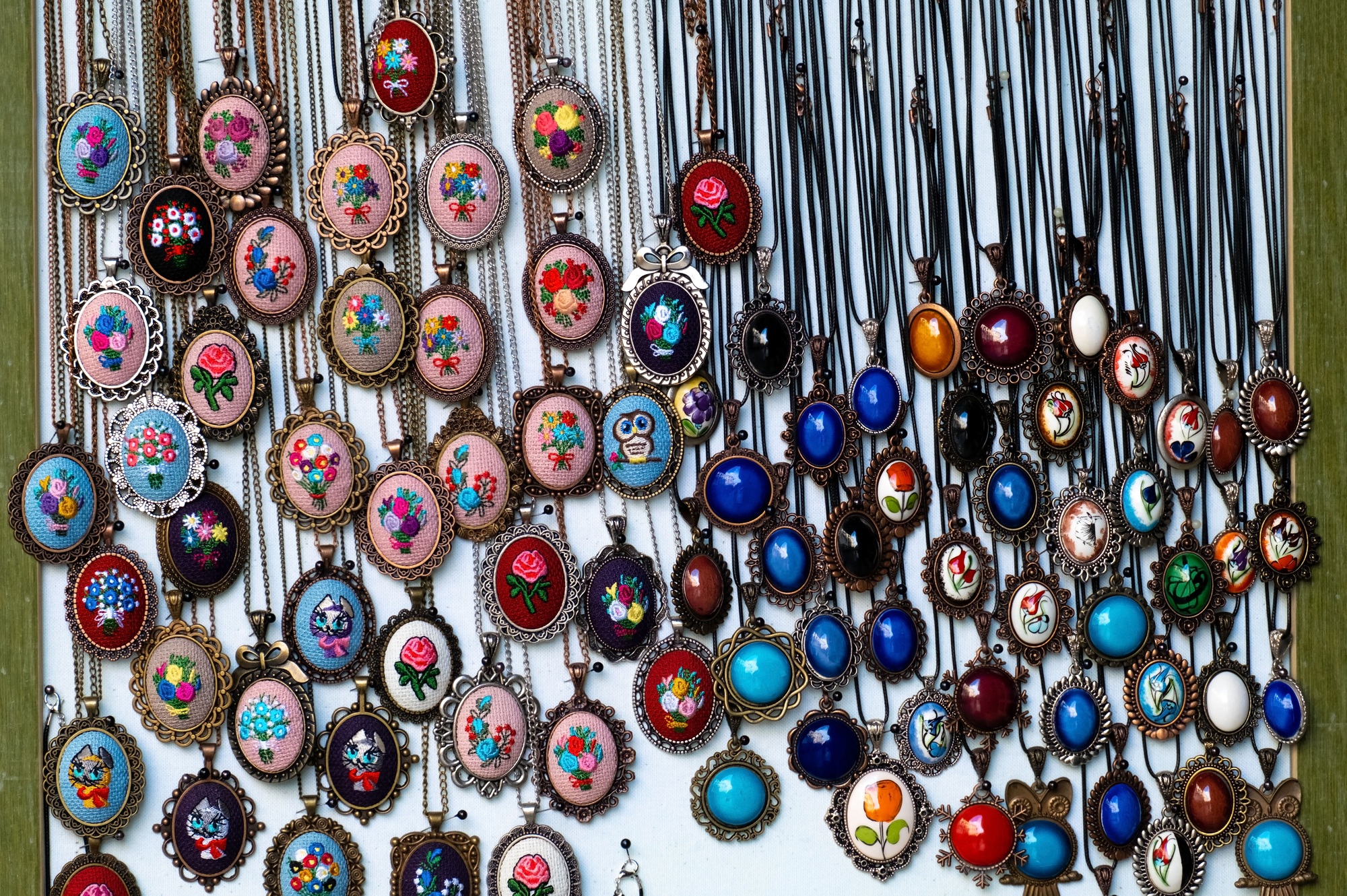 Antique medallions on the window of a flea market .