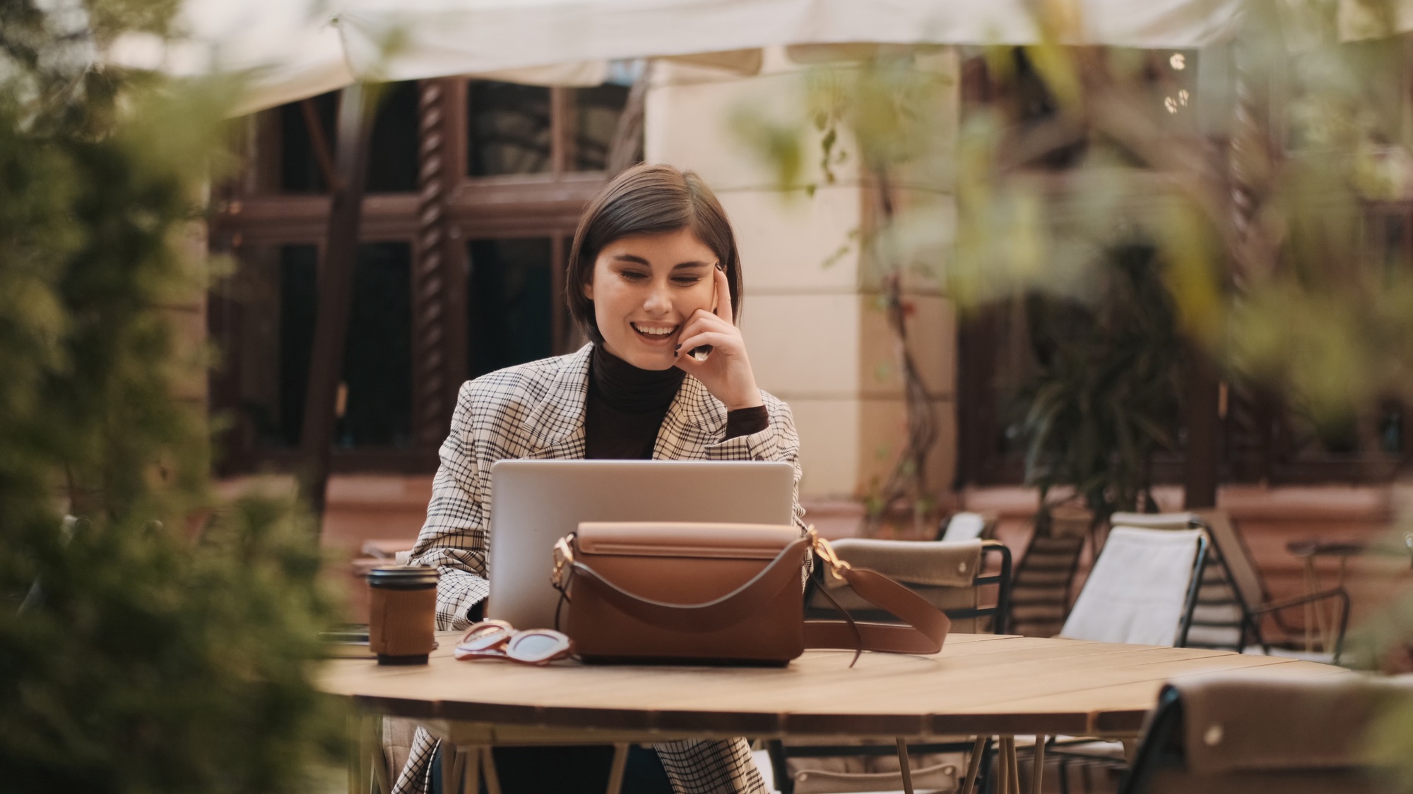 Beautiful lawyer looking happy talking on video call with custom