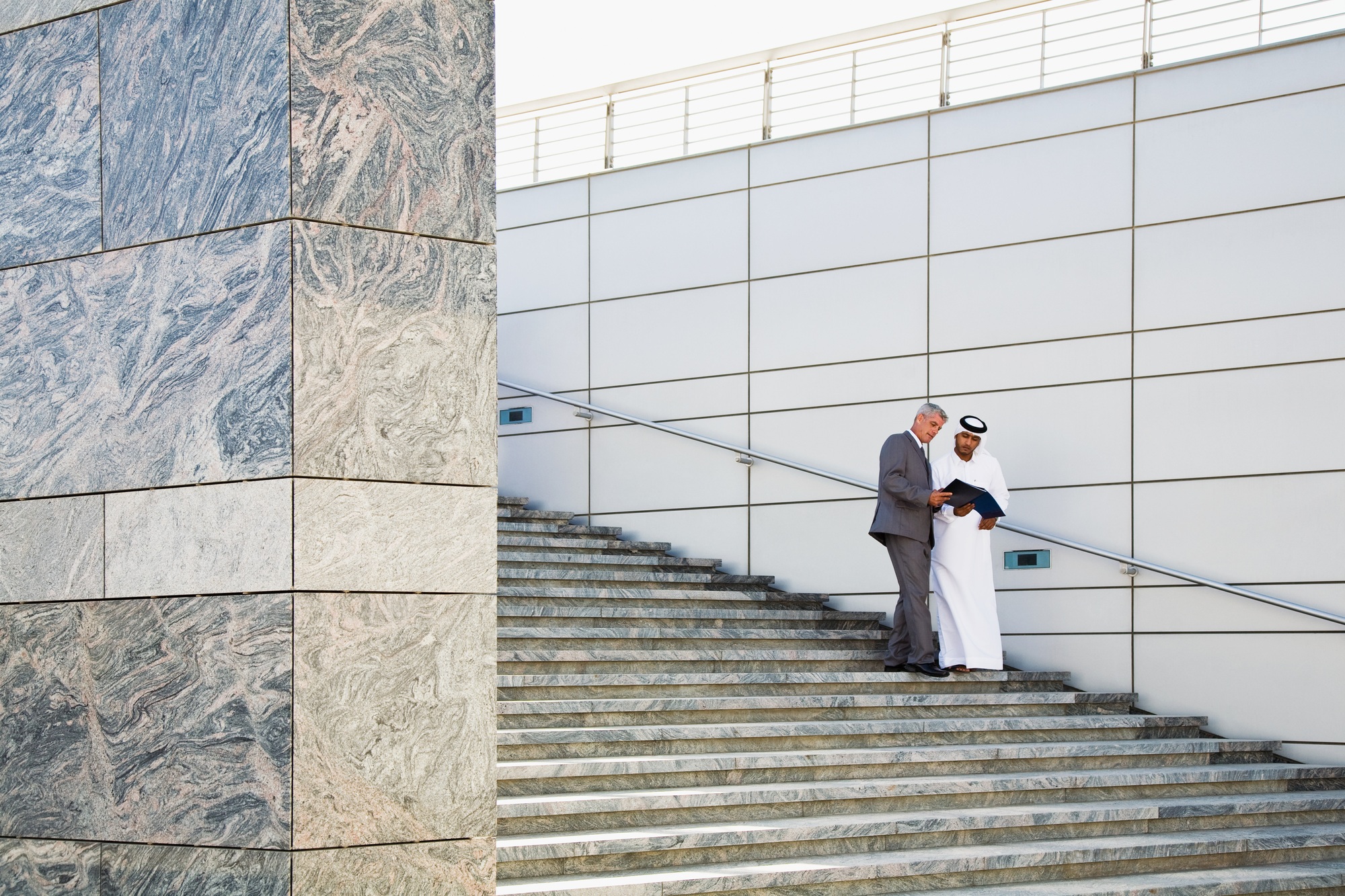 Businessmen on steps