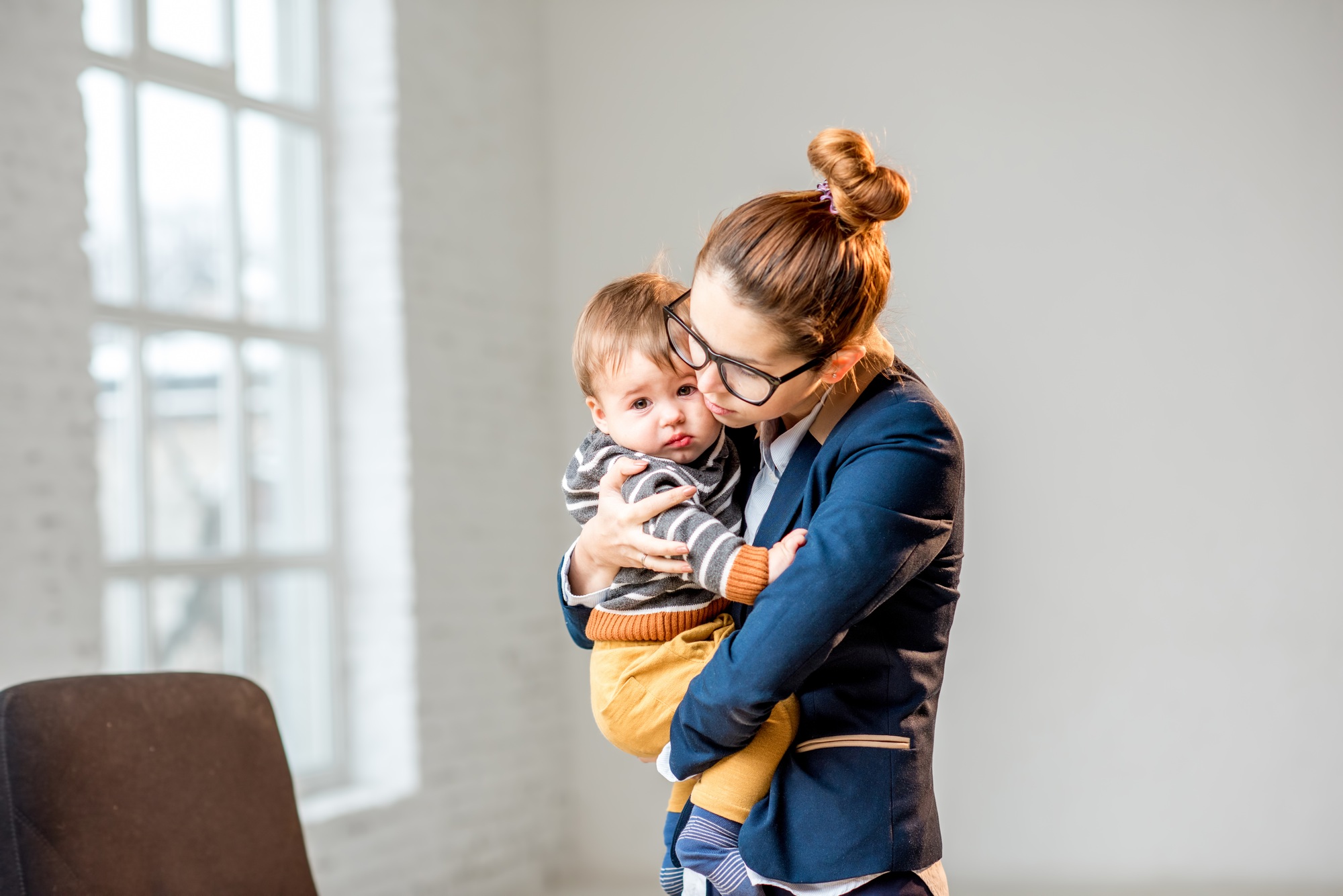Businesswoman with her baby son