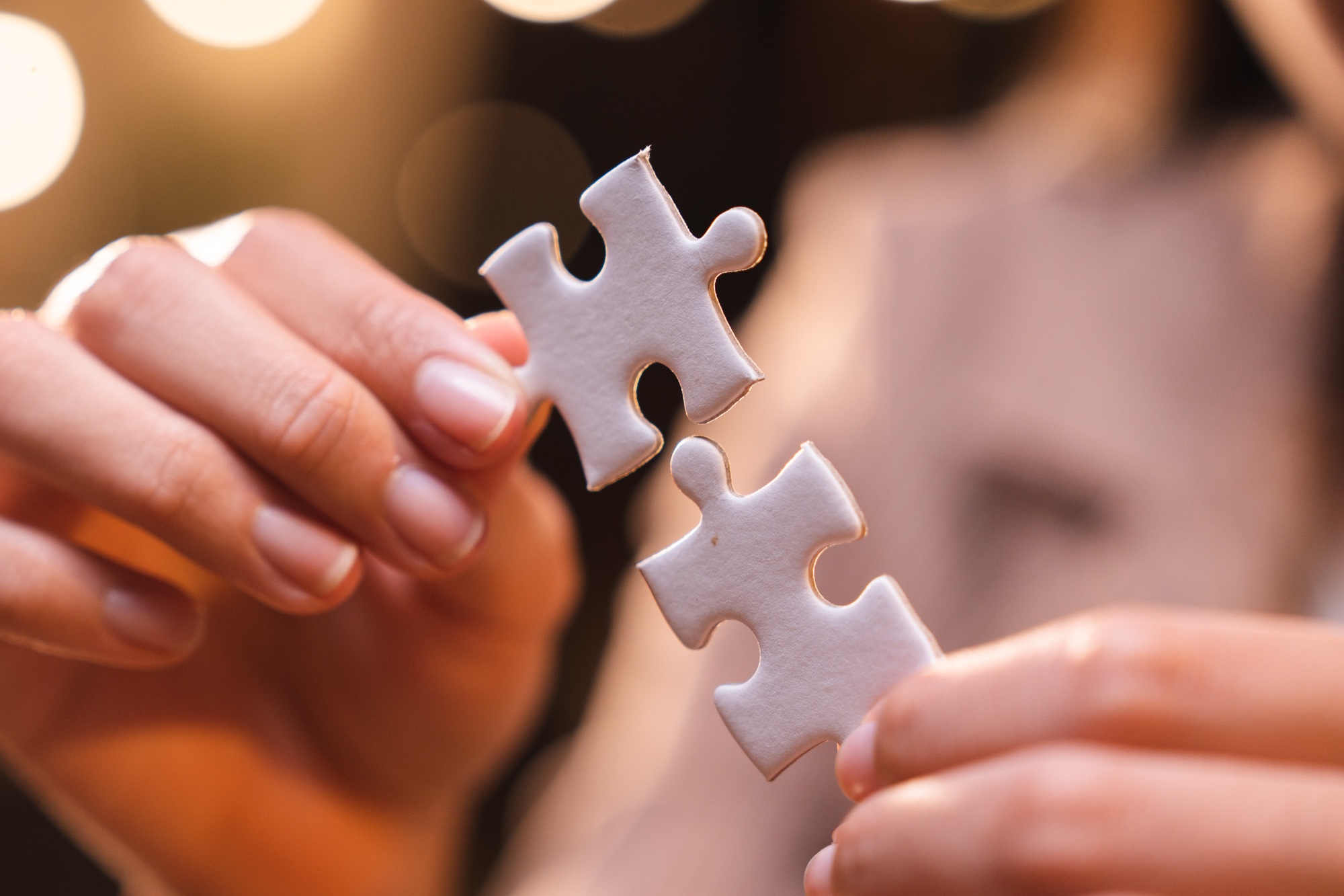 Concept of integration and startup with puzzle pieces merger with teamwork of business worker