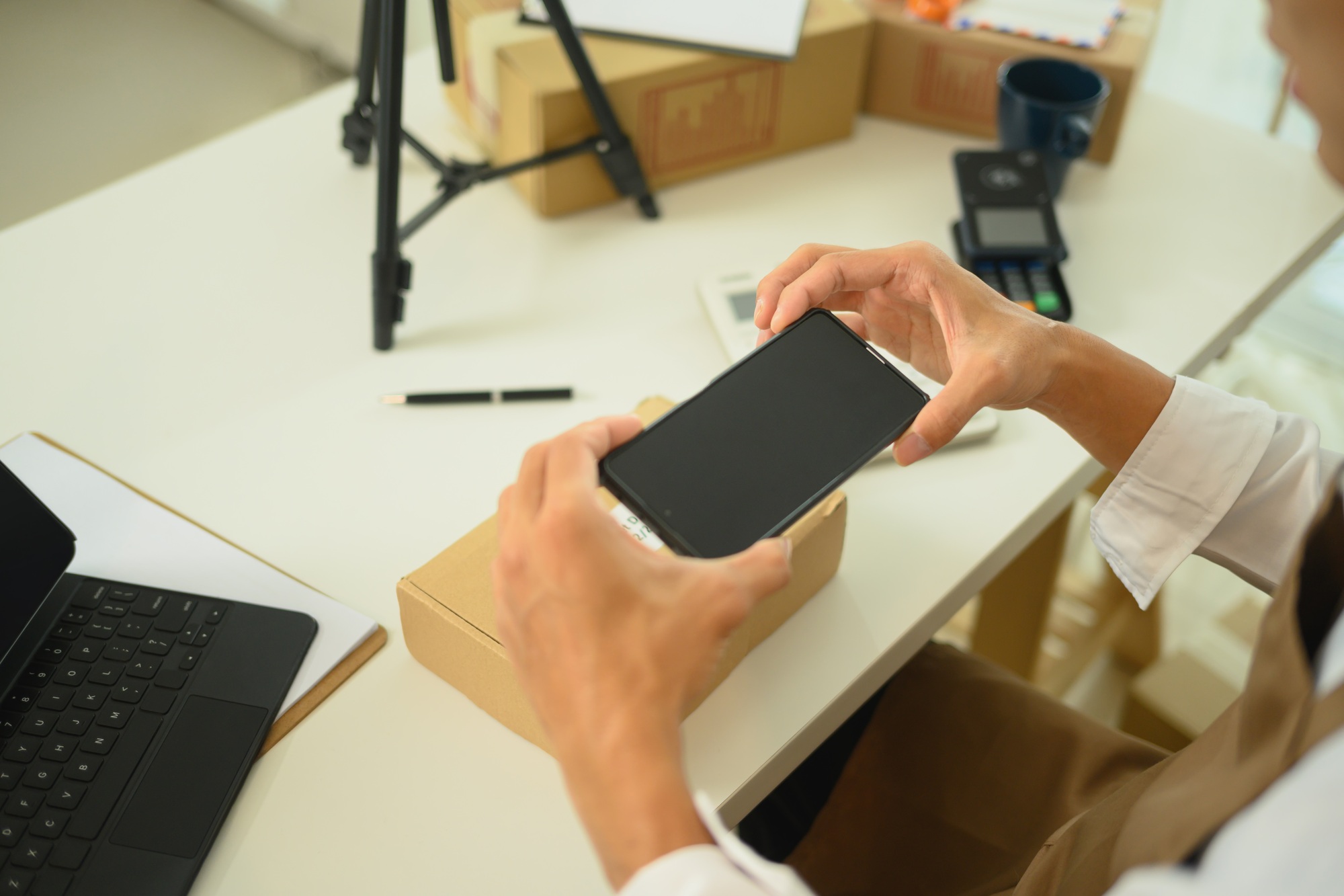 Cropped shot of business owner taking product photos for online sales