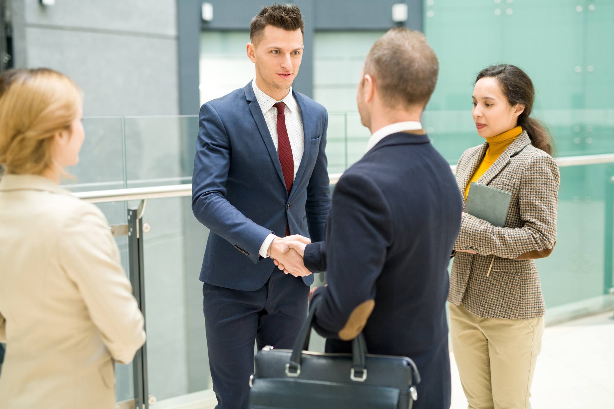 Handsome Boss Shaking Hands with Partner