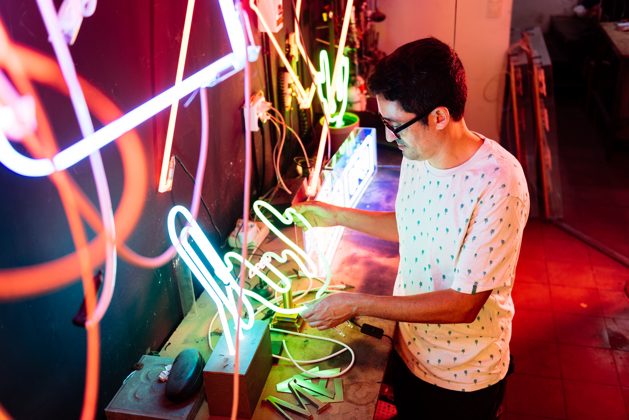 Neon Sign Artist Working on a Custom Neon Sign in a Workshop