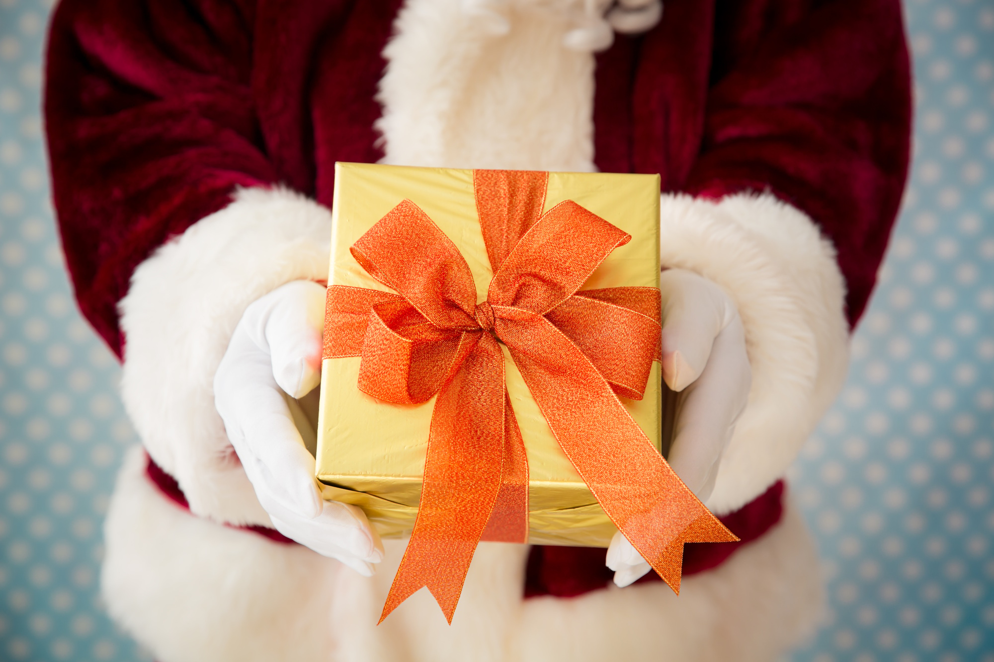 Santa Claus holding gift box