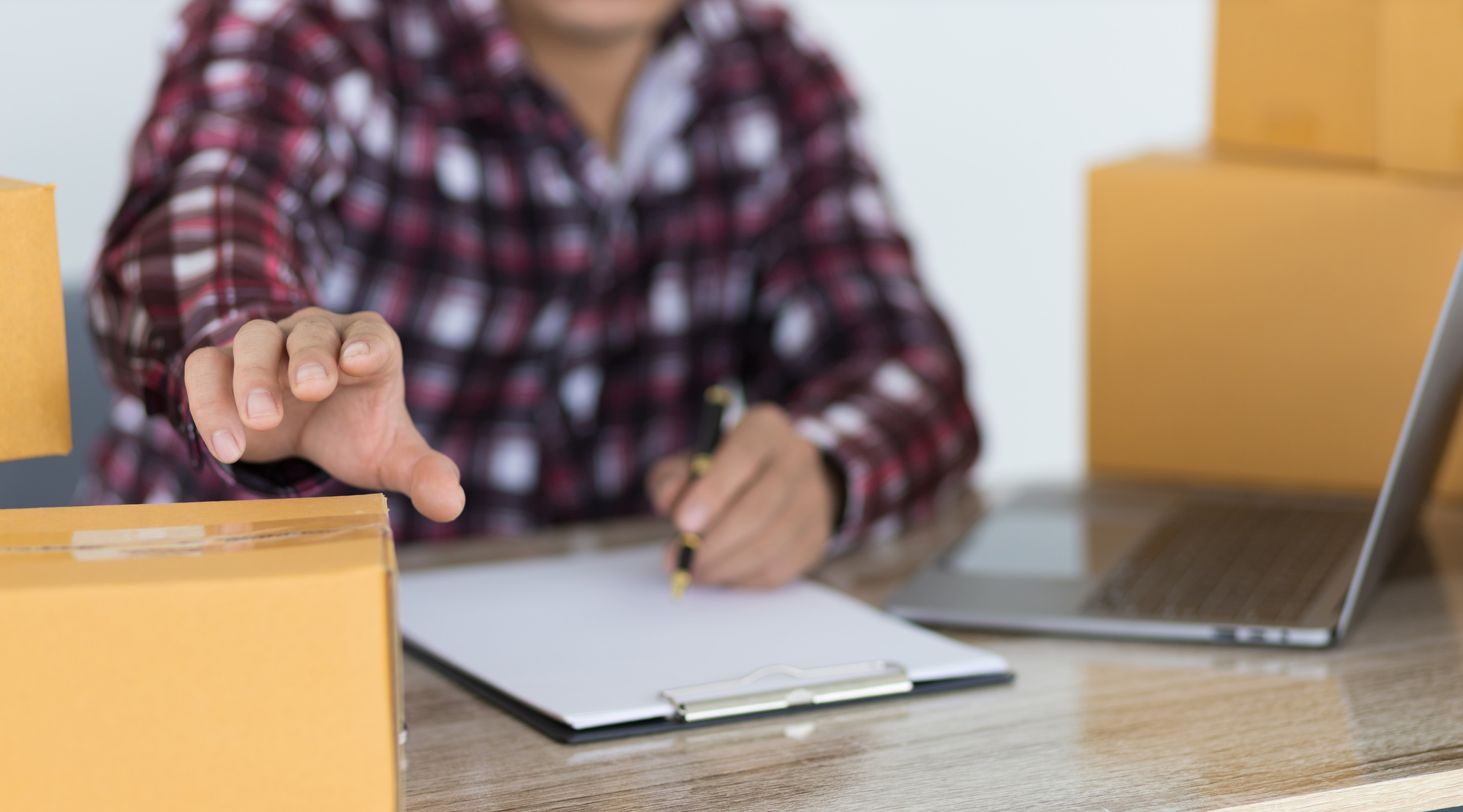 Small business owners working with parcel boxes.