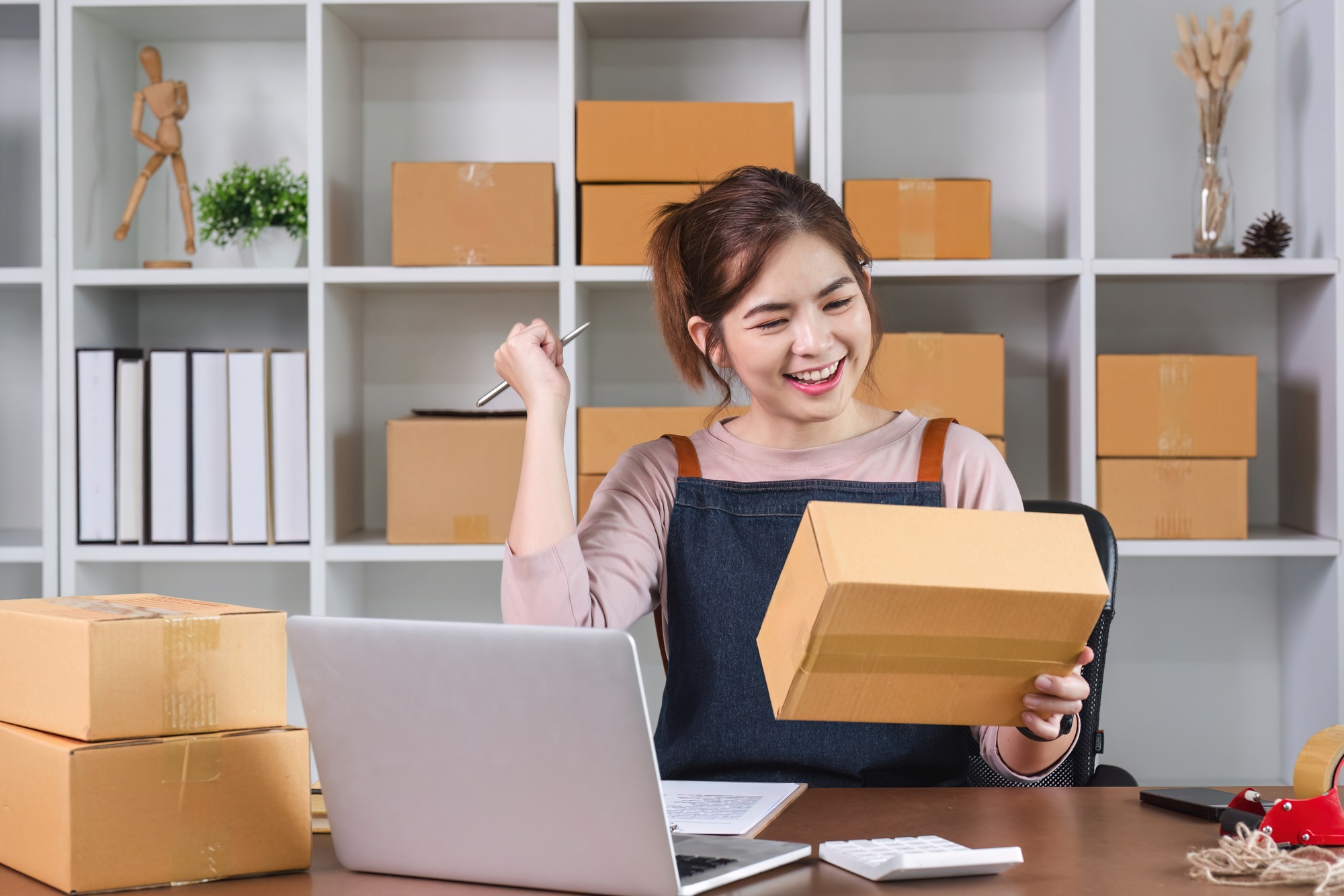 SME business owners celebrate success in satisfactory product sales.