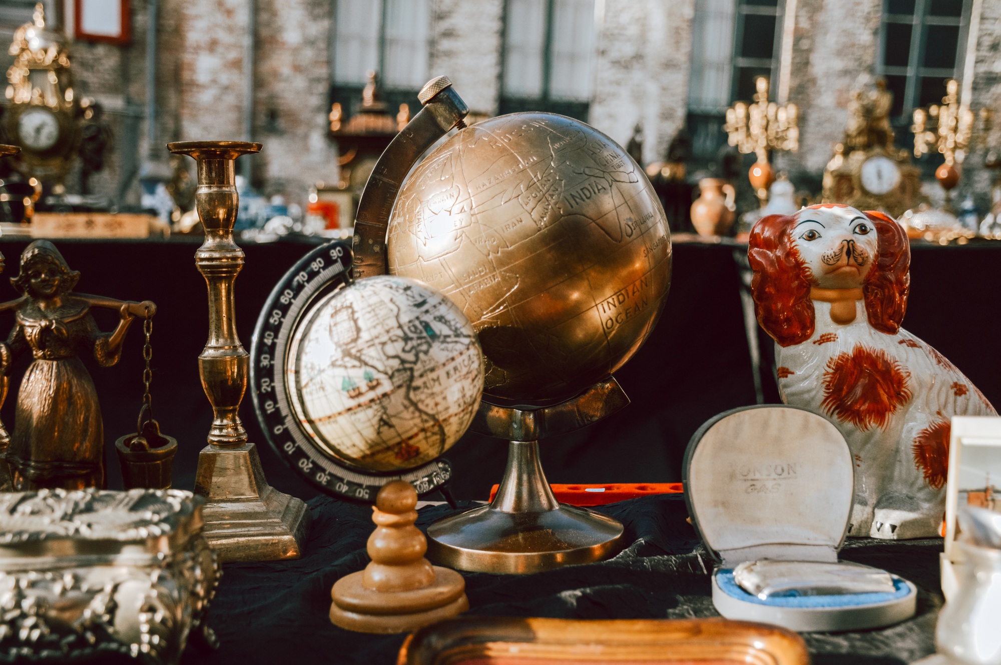 Two globes on a table at the flea market