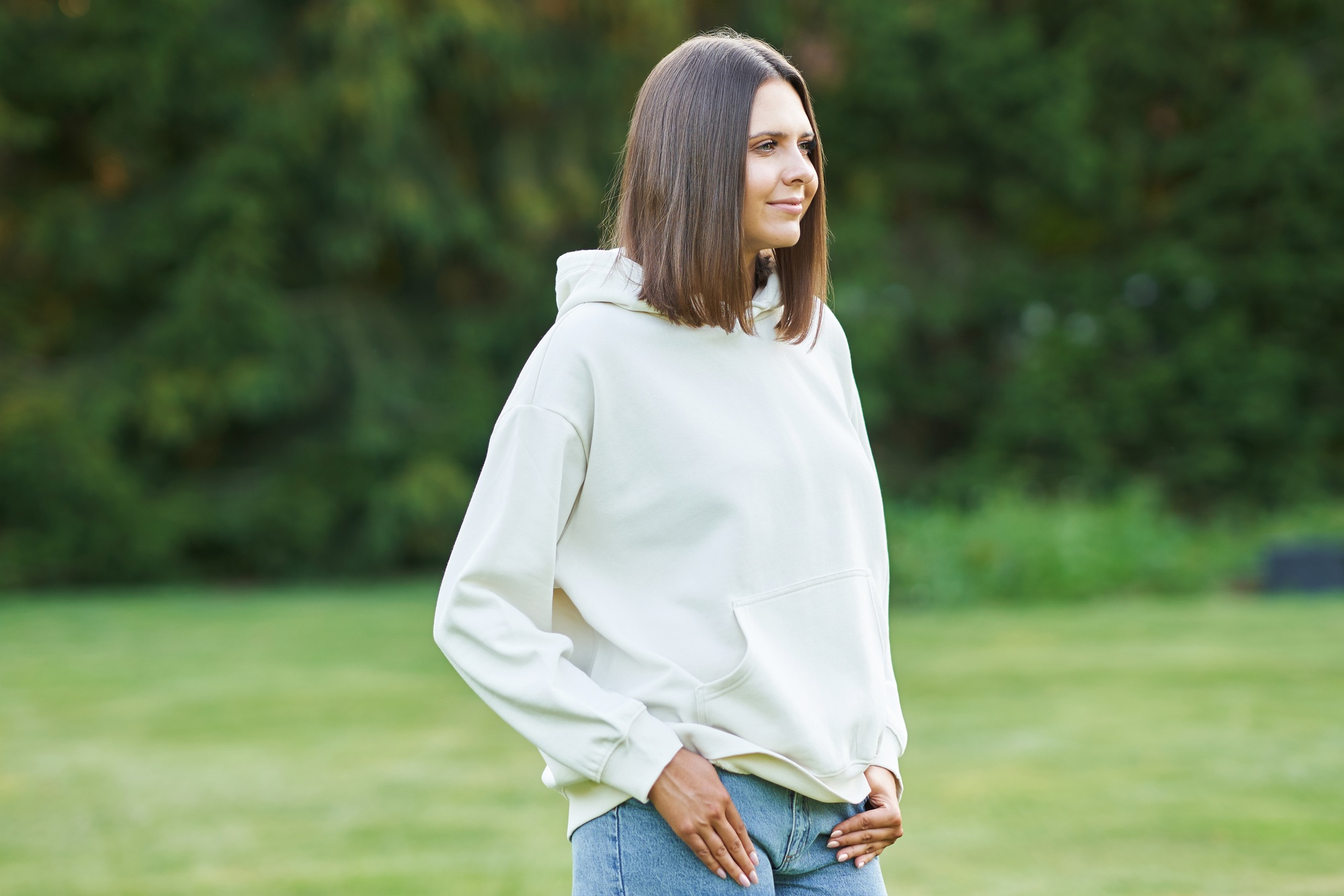 Young woman in white hoodie.