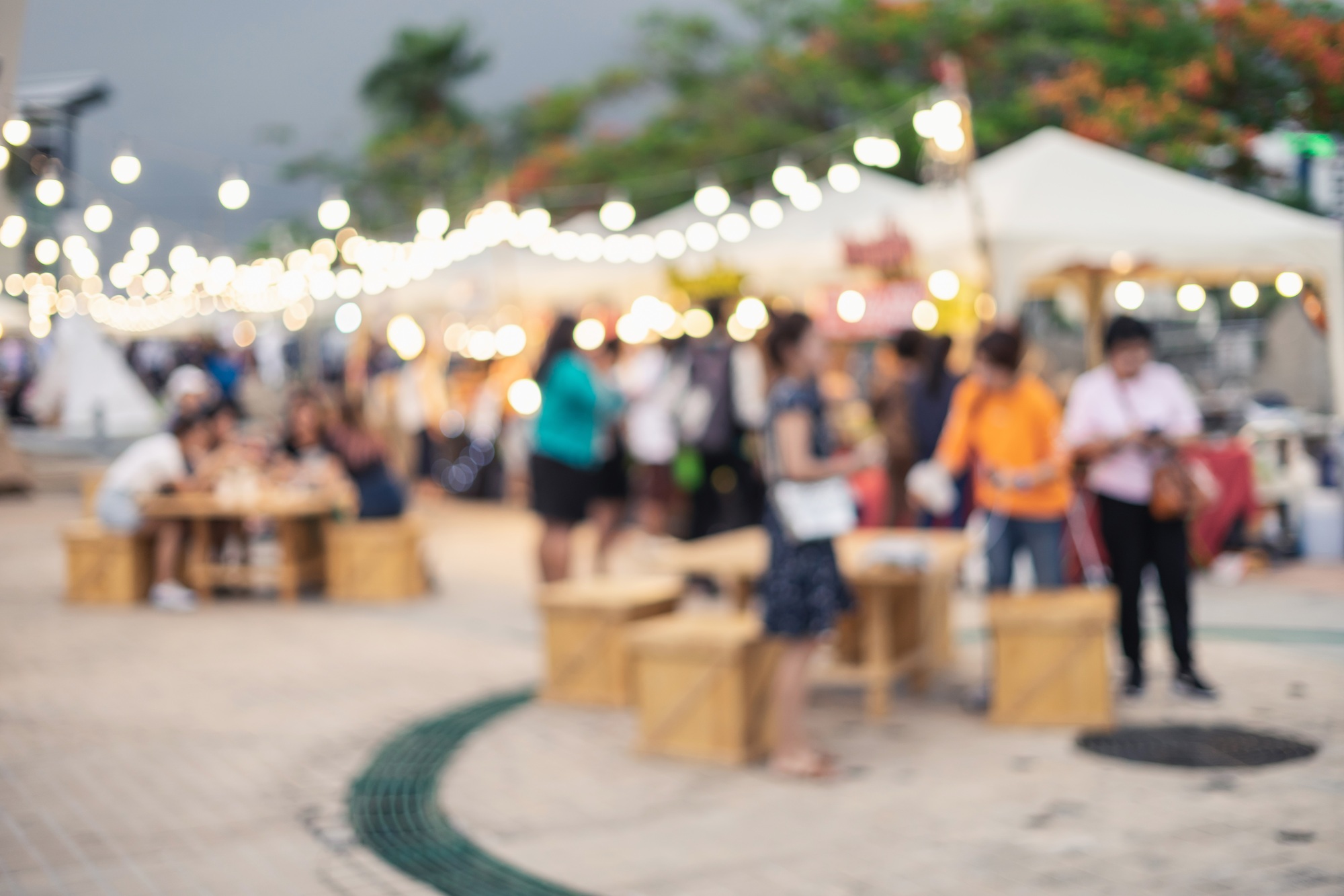 Abstract blurred image of people walking at the night market