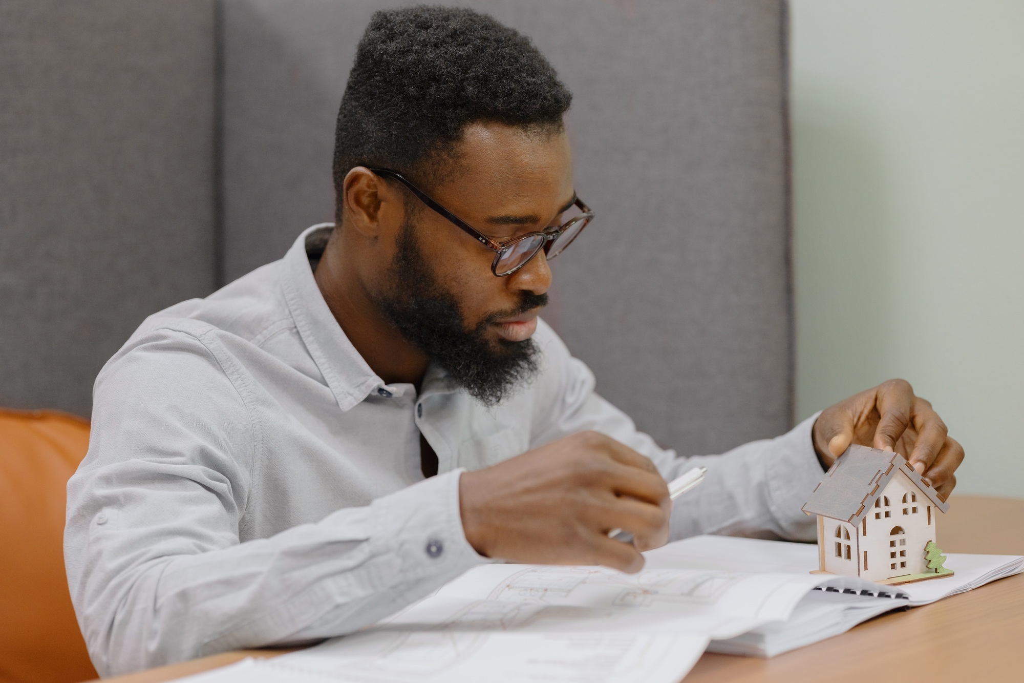African American male architect or designer or interior designer in his office creates
