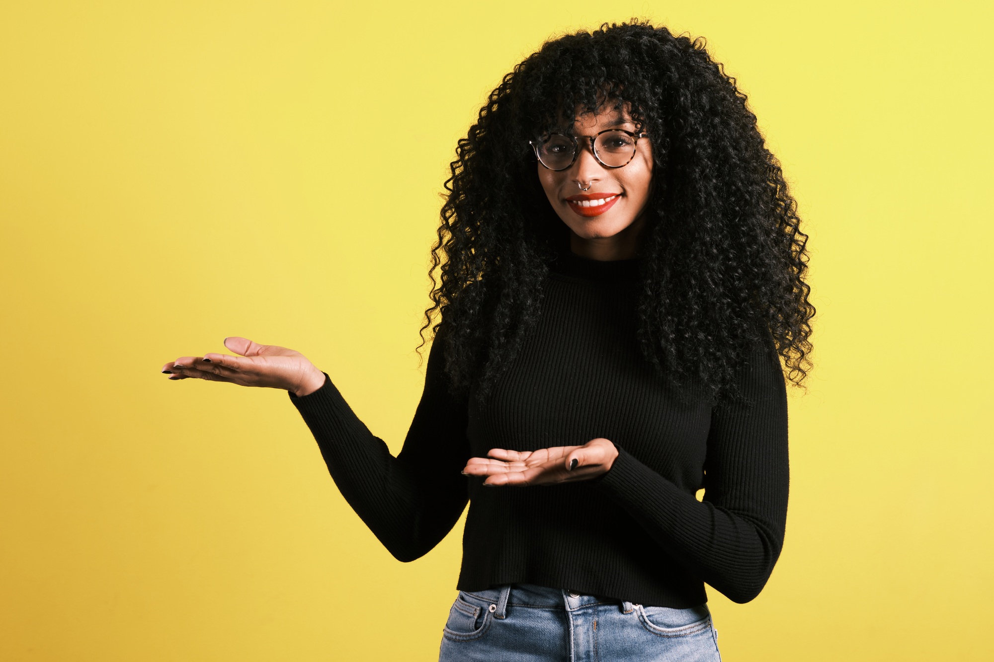 afro american woman with yellow background with copy space for product placement