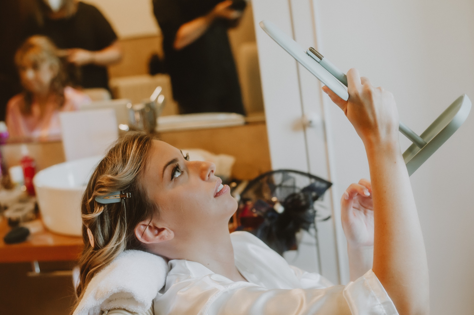 Bride being made up before the wedding