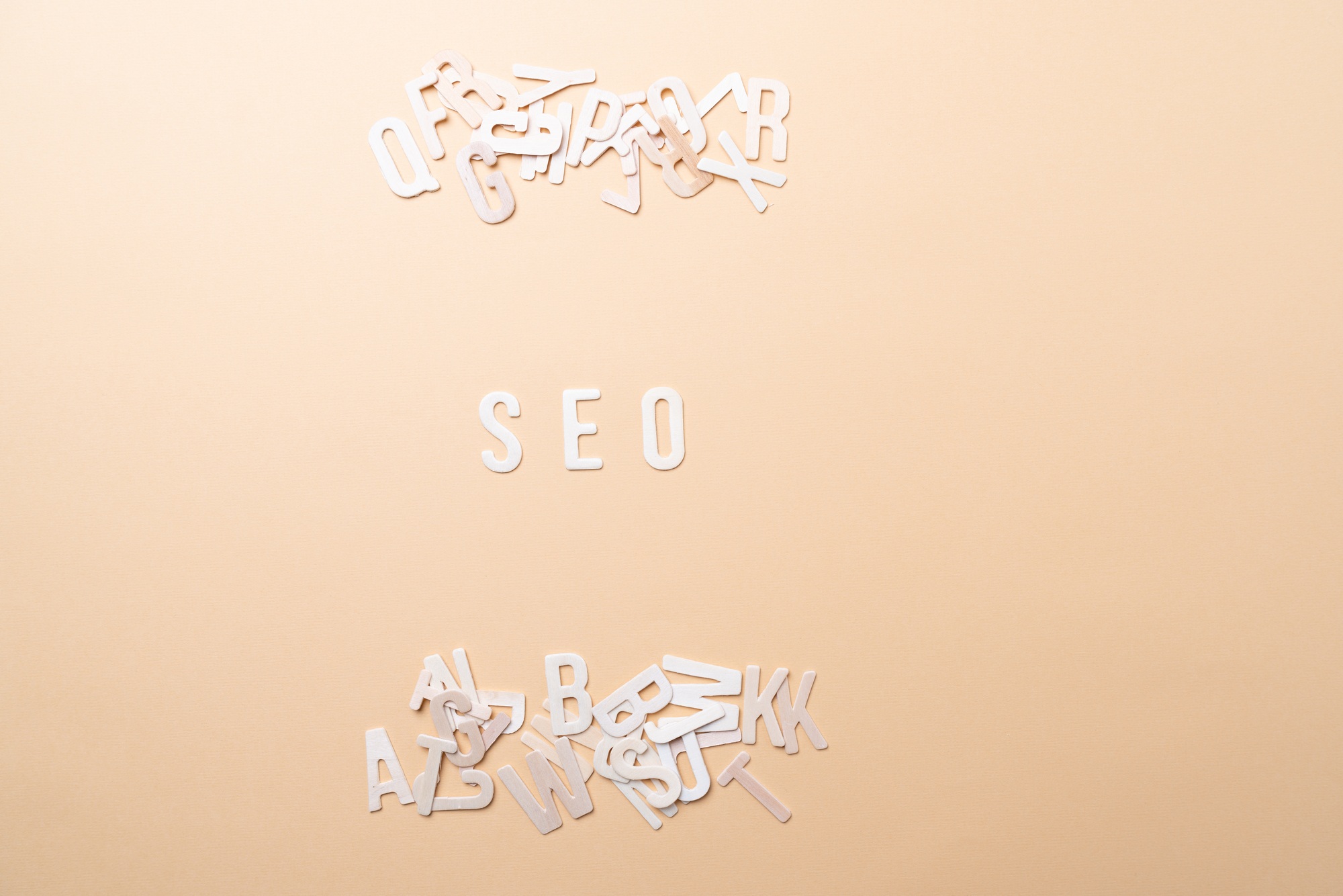 Businessman Building SEO concept with Wooden letters
