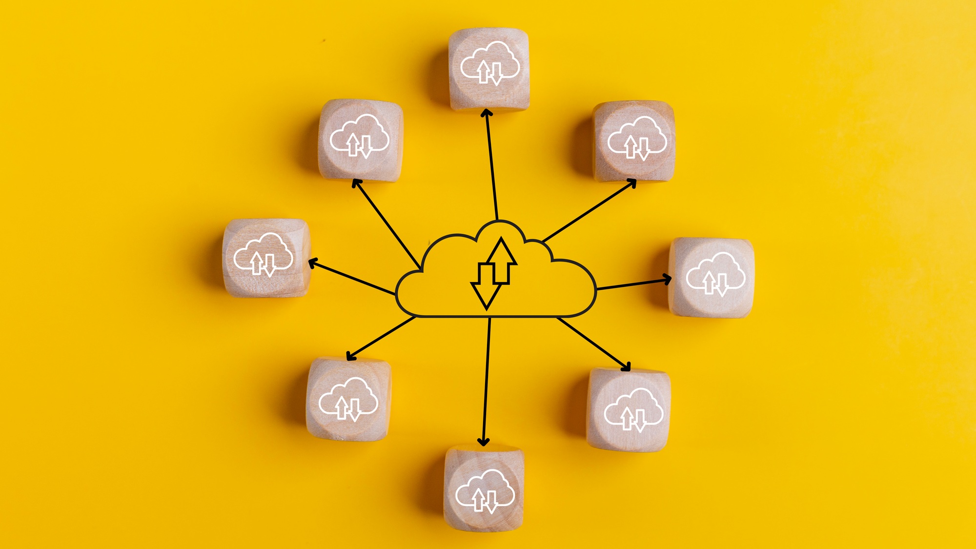 Cloud computing concept with wooden cubes on a yellow background. Top view. Cloud technology.