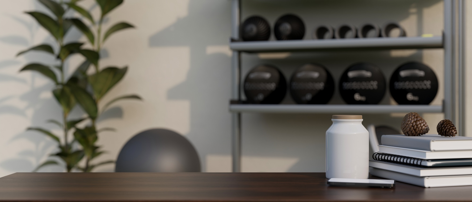 Copy space on tabletop with decor against blurred fitness with sport equipments in background