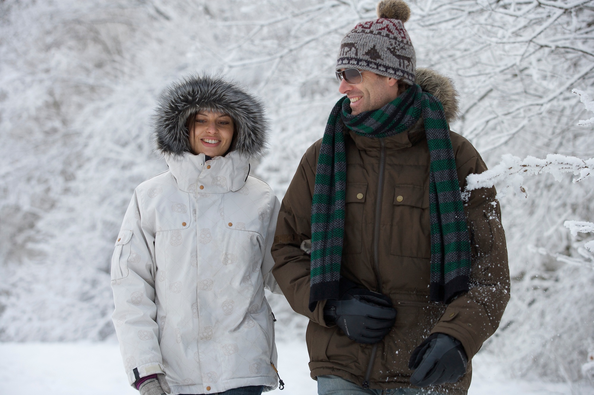 Couple walking in the snow.