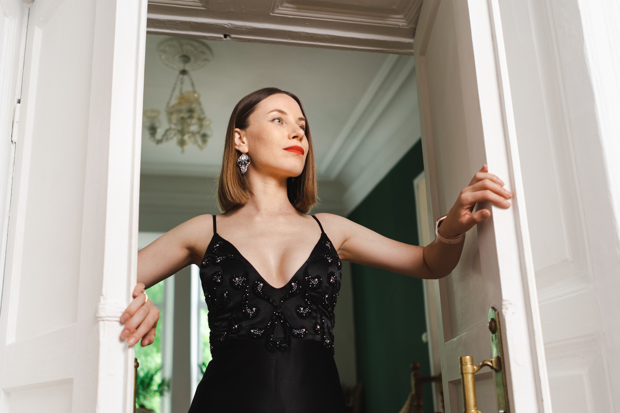 High fashion portrait of elegant woman in long black dress