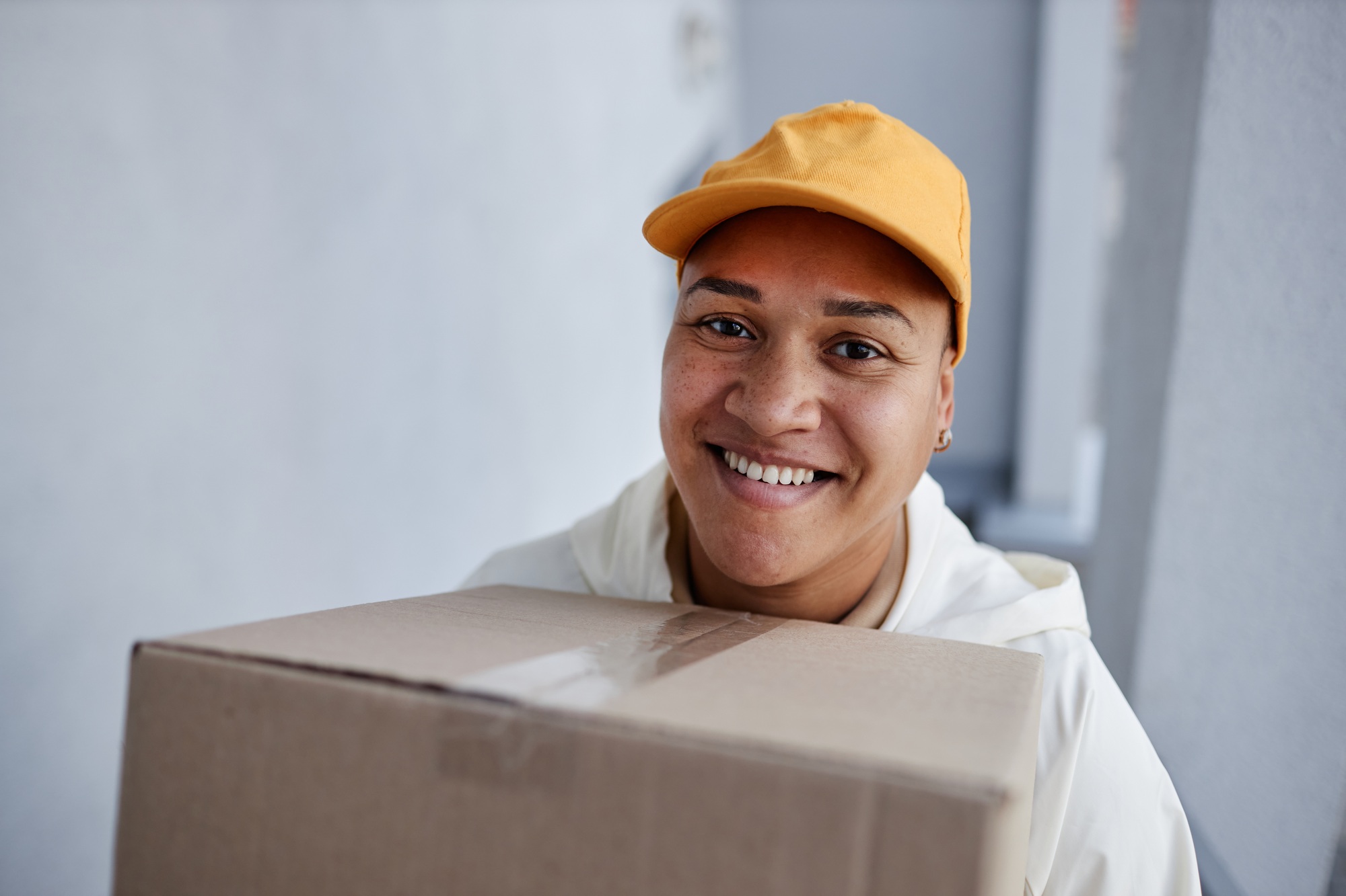 Smiling Delivery Worker with Package