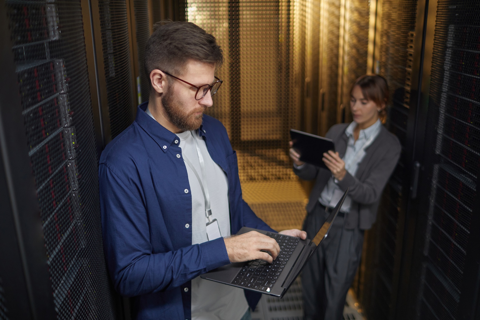 Technicians Managing Server Equipment in Data Center