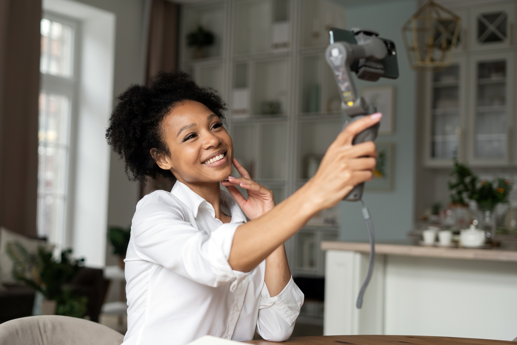 woman communicates by video link in social network uses phone
