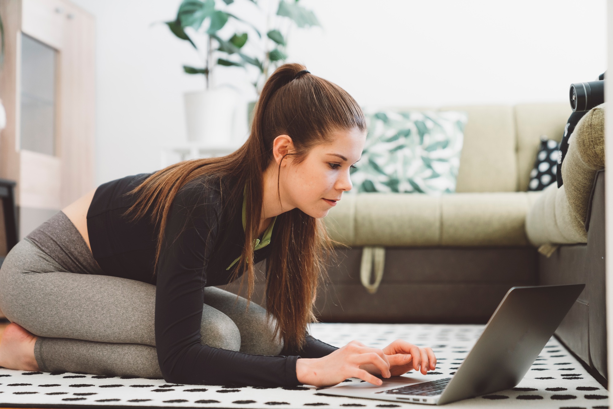 Woman searching for a home workout on her laptop