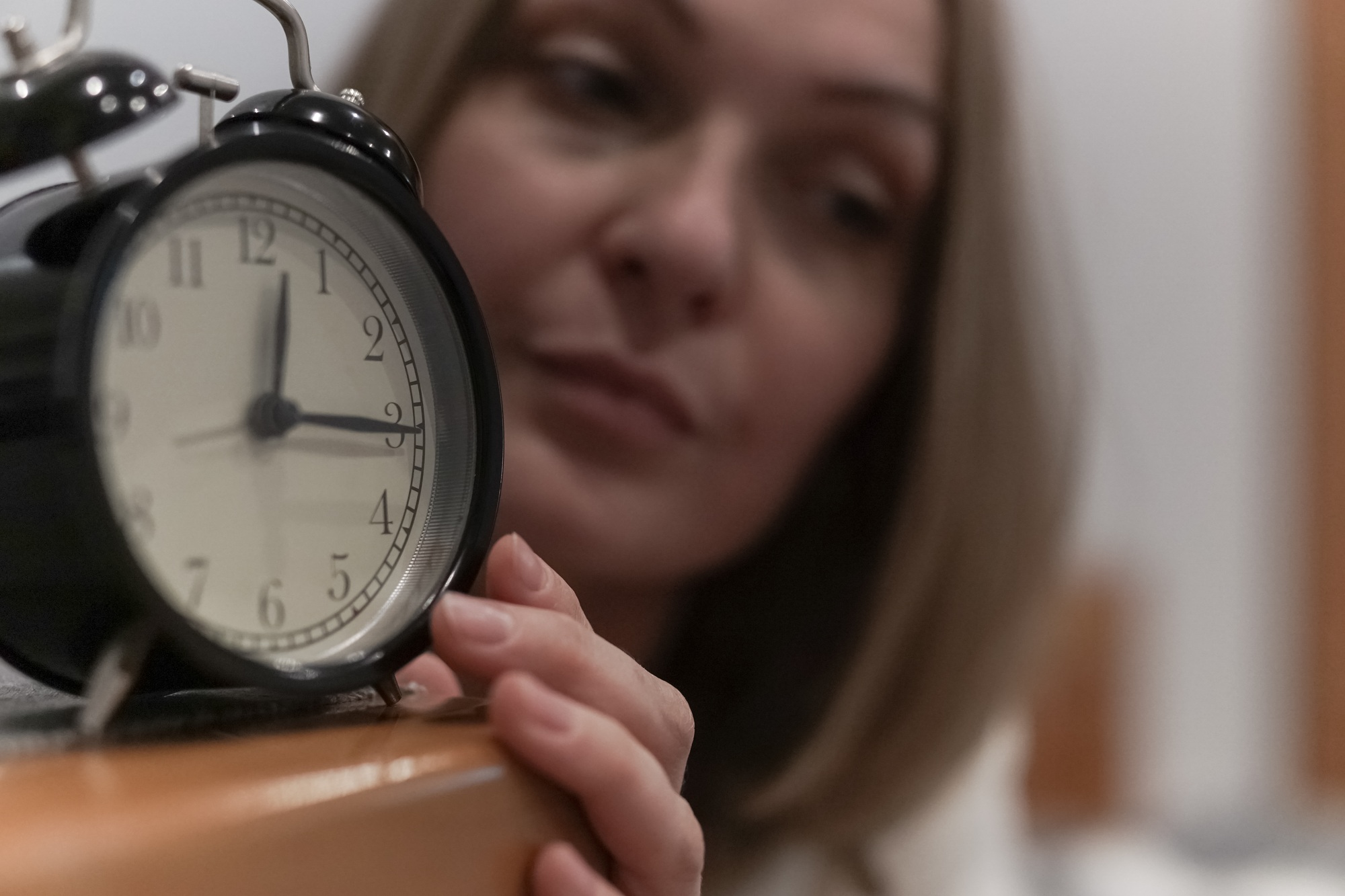 A woman and an alarm clock