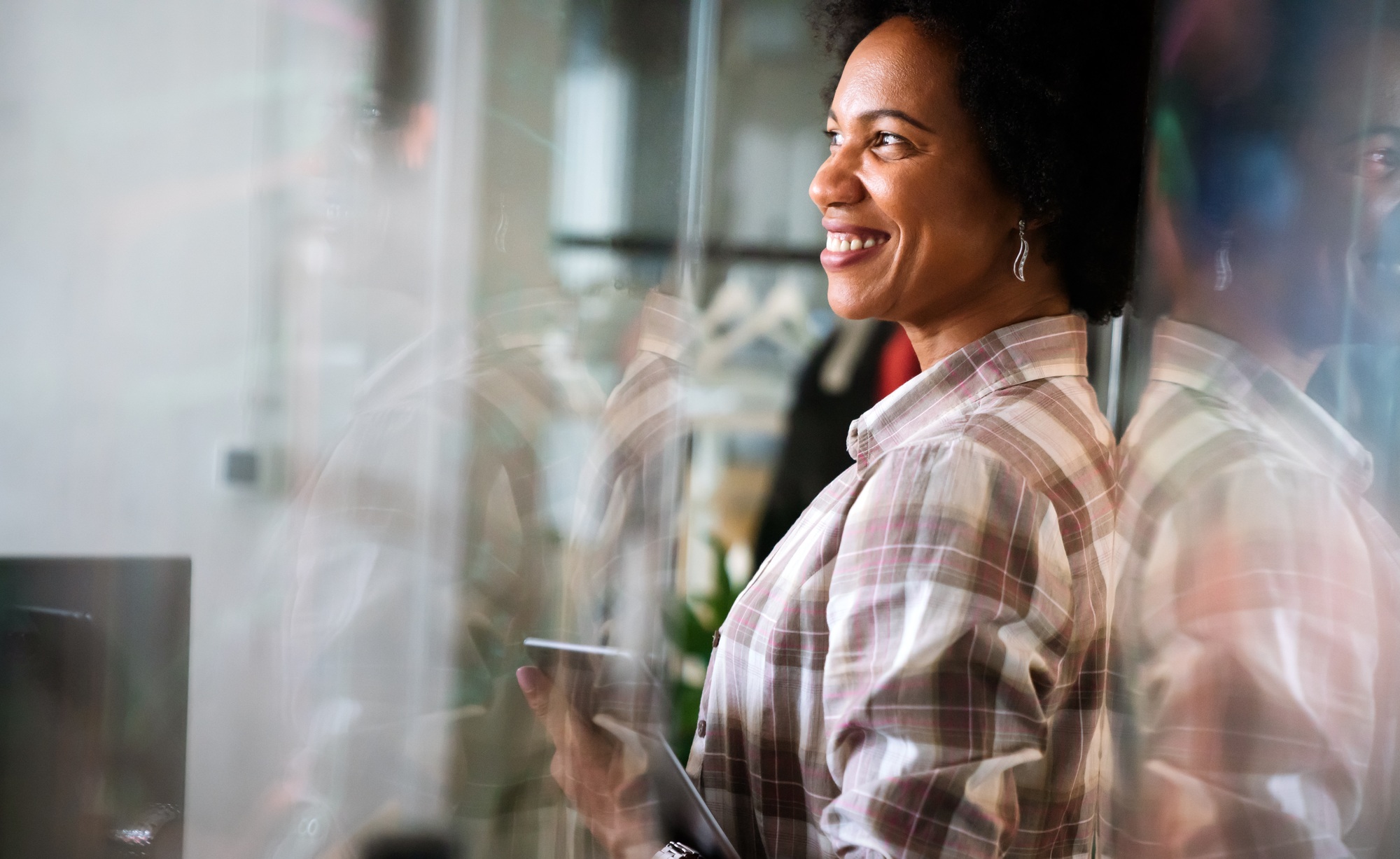 African american woman with tablet, innovation in research and programming for future app technology