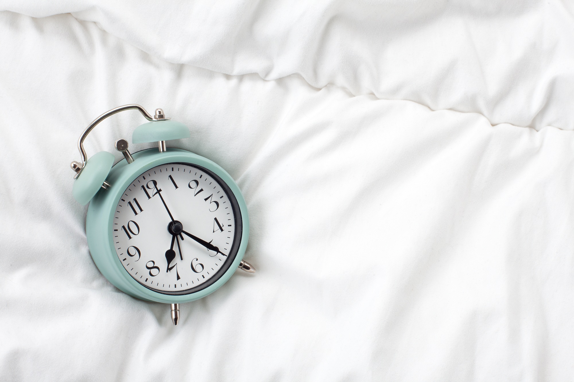 Alarm clock in the bed at home