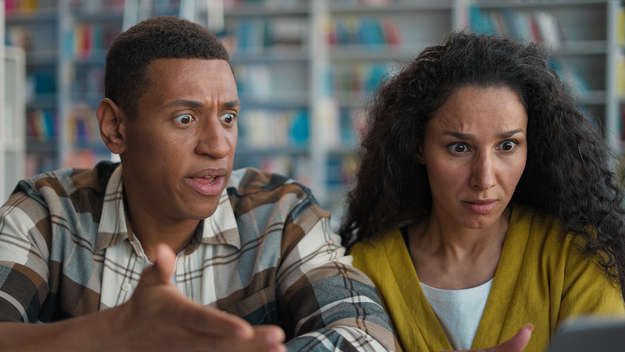 Angry upset African American man Caucasian Hispanic woman students laptop loss data project deleted