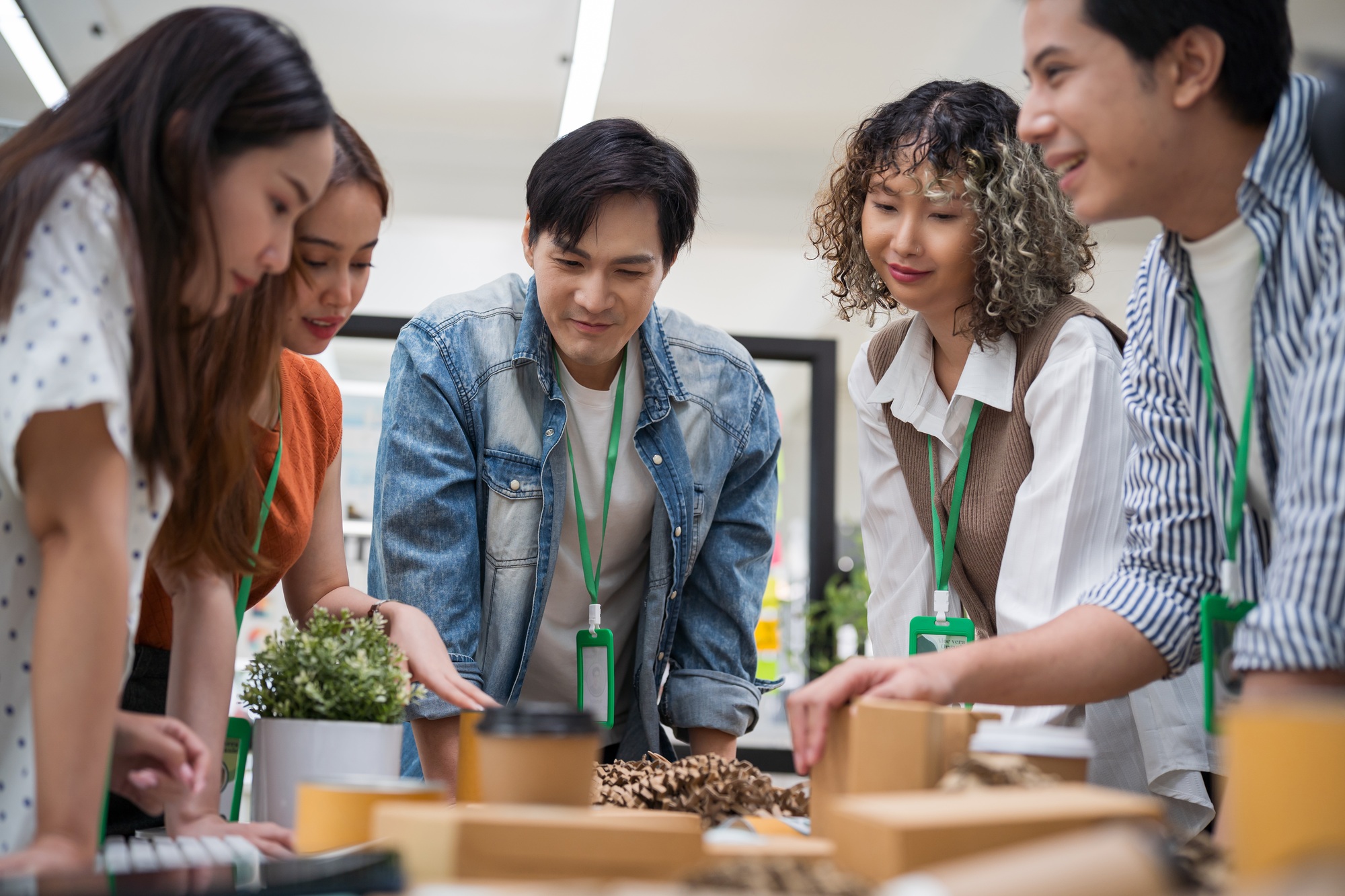 Asian business meet sustainable practices, focusing on reuse, recycling, and environmental product