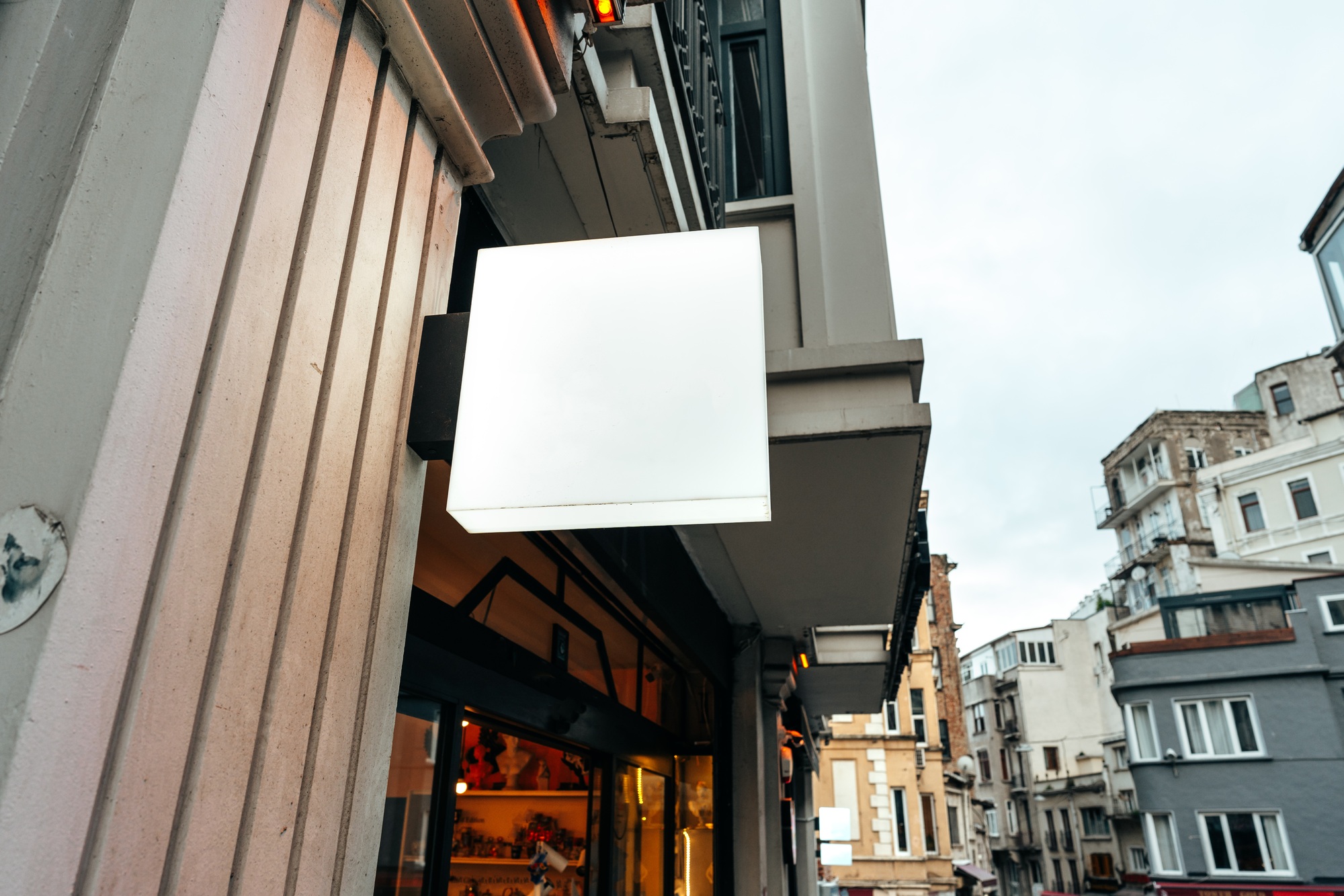 Blank store signboard design mockup in the street
