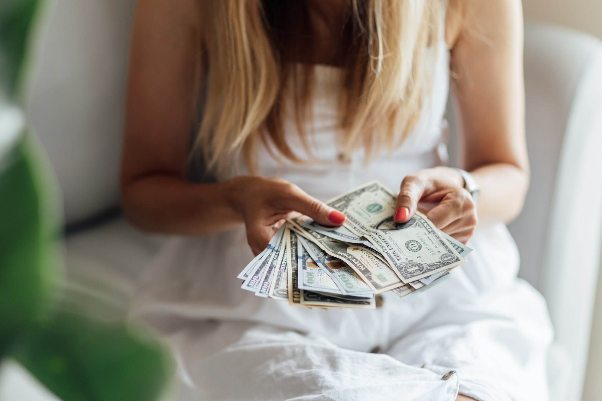 Business professional counting expenses income for holiday shopping.