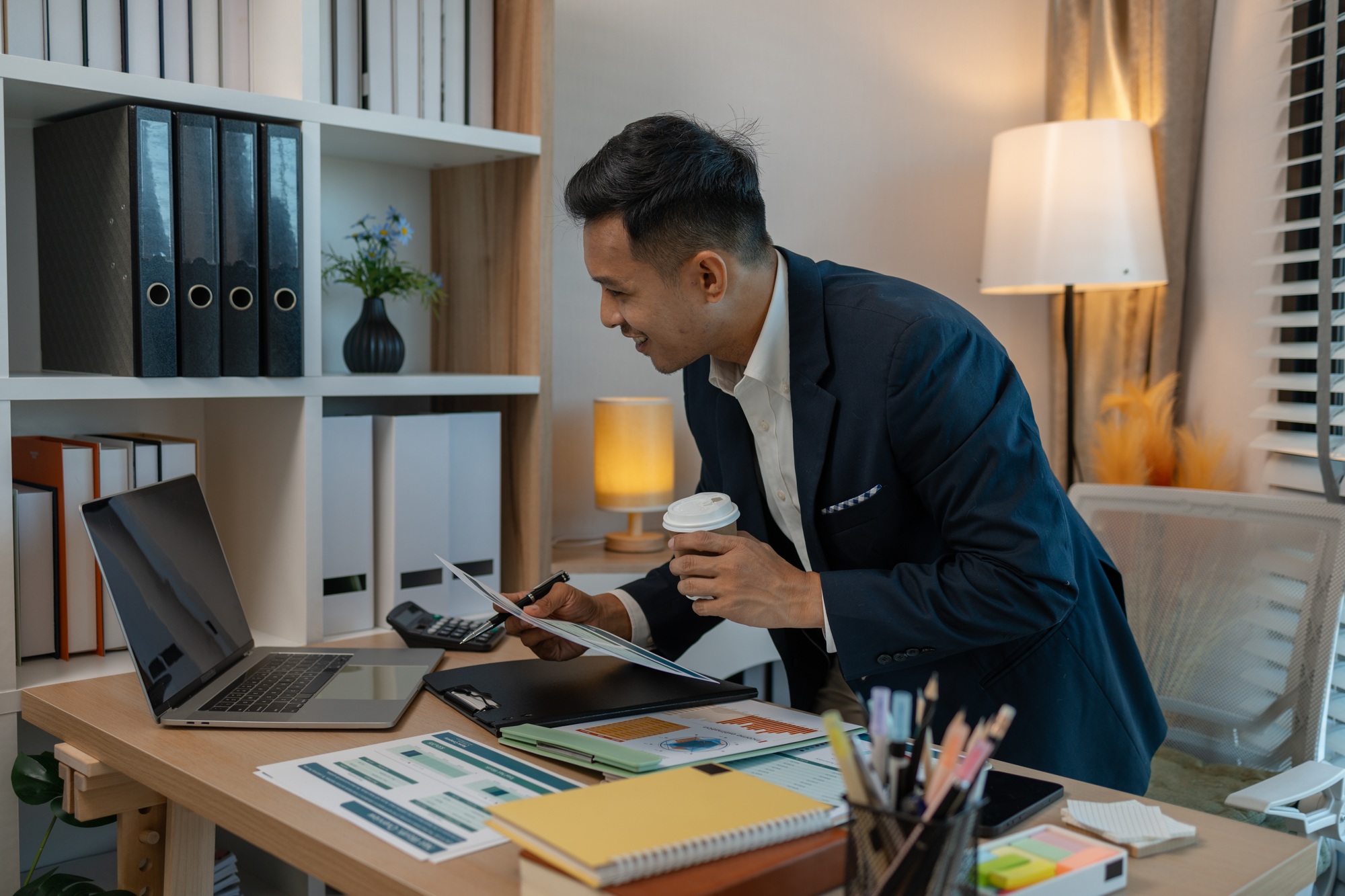 businessman giving presentation in office, an investor pitching to a room with charts and graphs sho