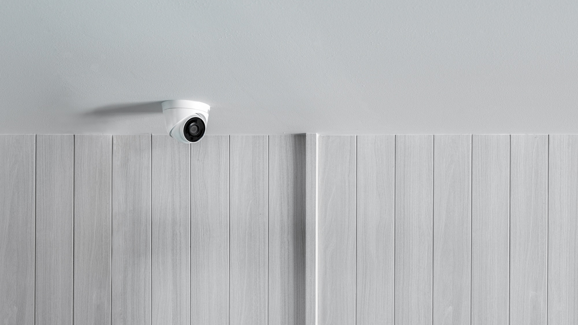 CCTV camera security system on interior building wall for monitoring and safety