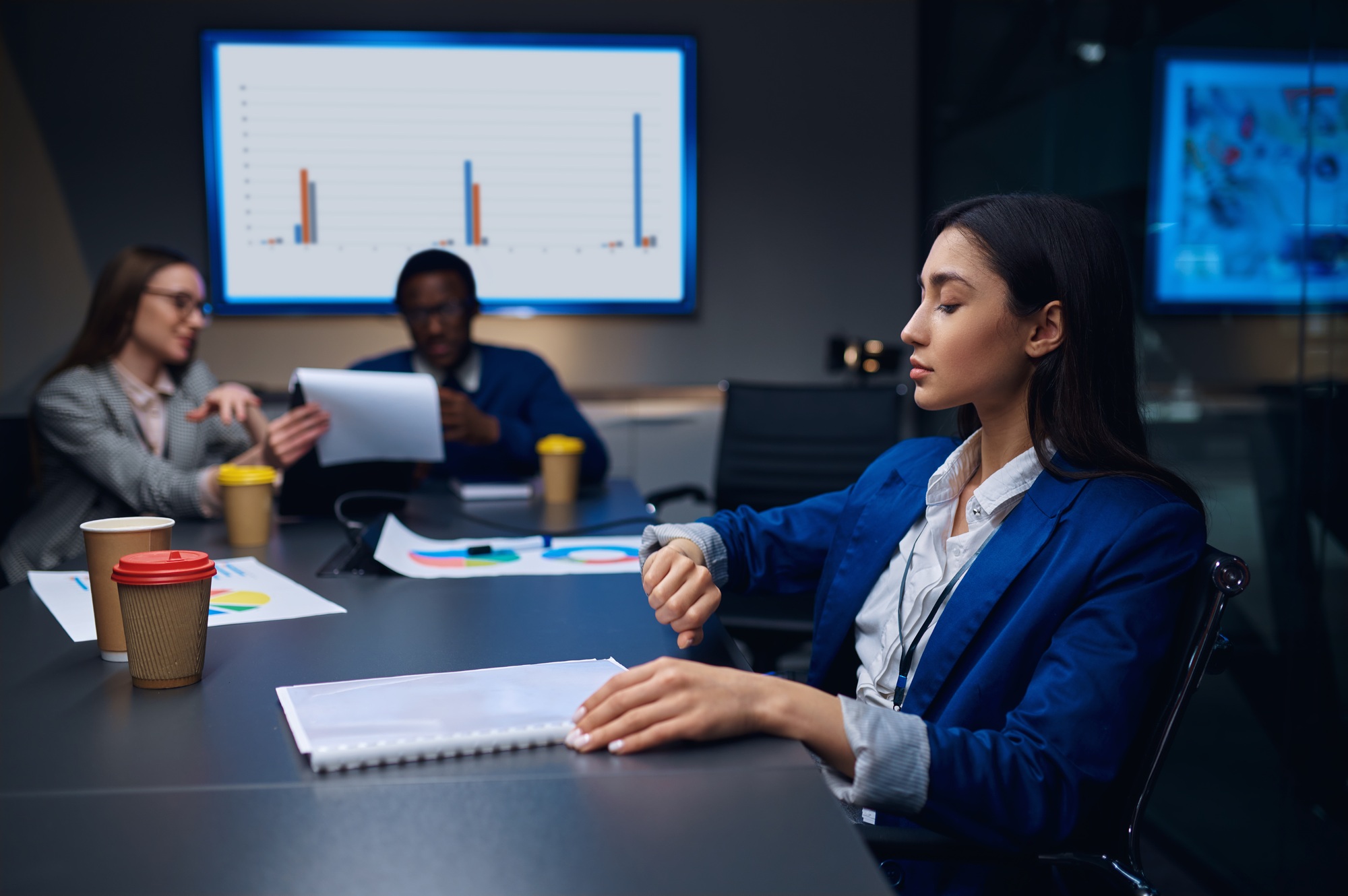 Coworkers on business negotiations in night office