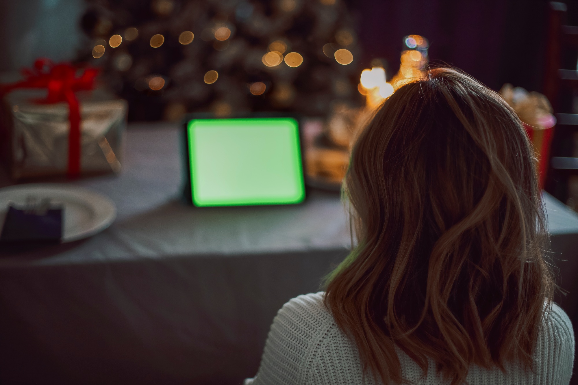 Happy young woman talking with friends on virtual zoom video call