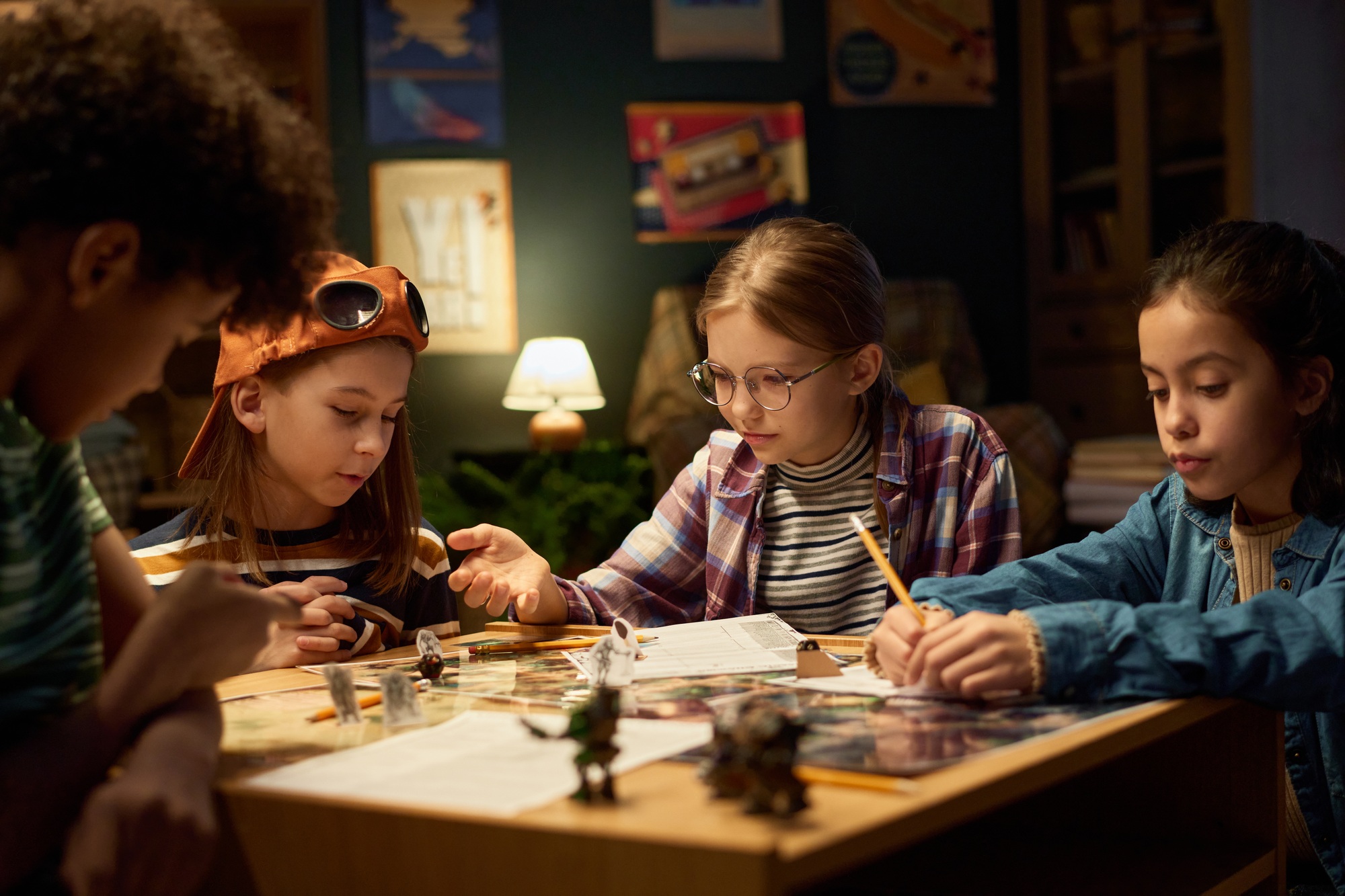 Kids reading rules of new tabletop game