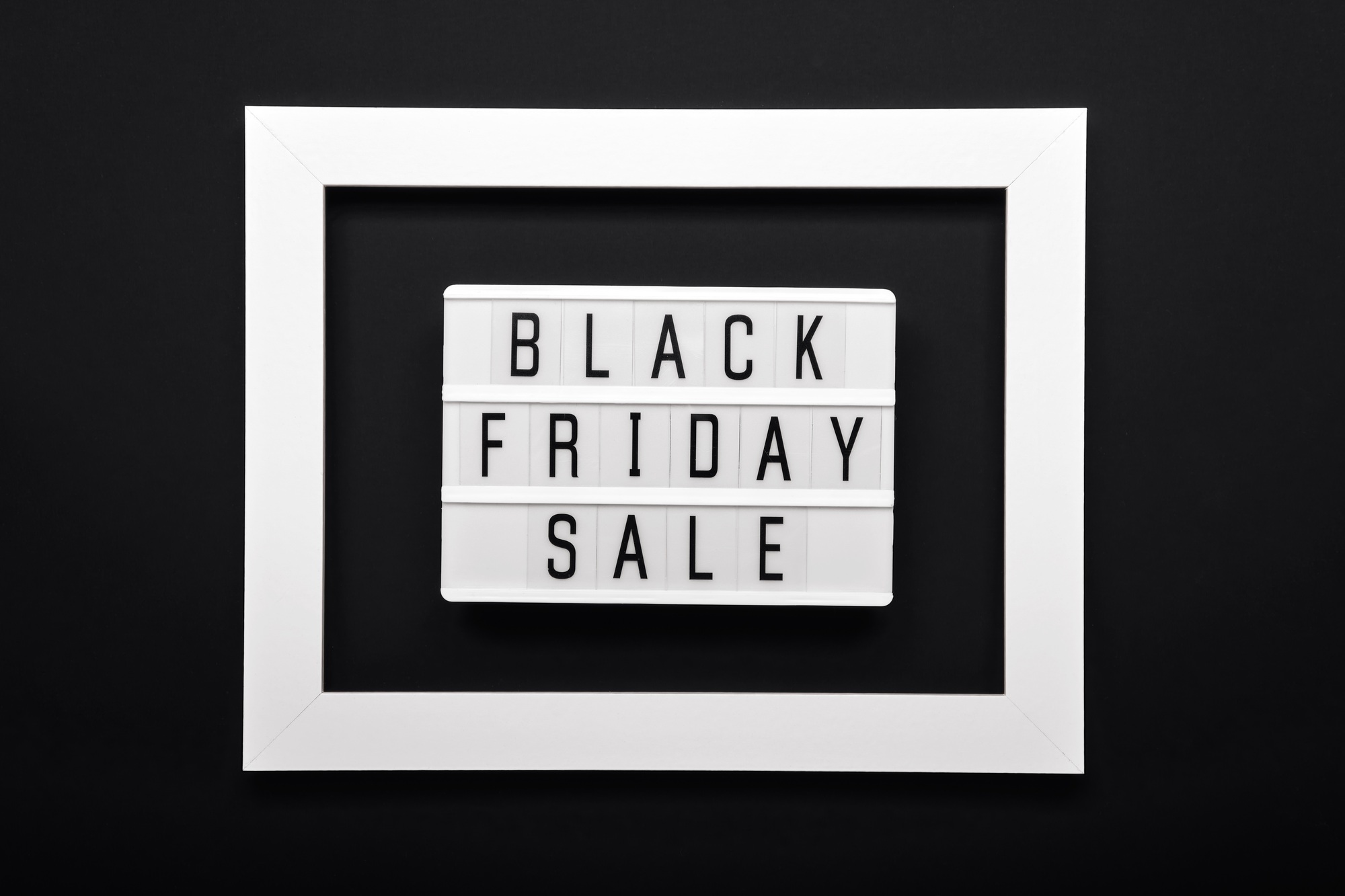 Lightbox with text BLACK FRIDAY SALE and and white frame on black background