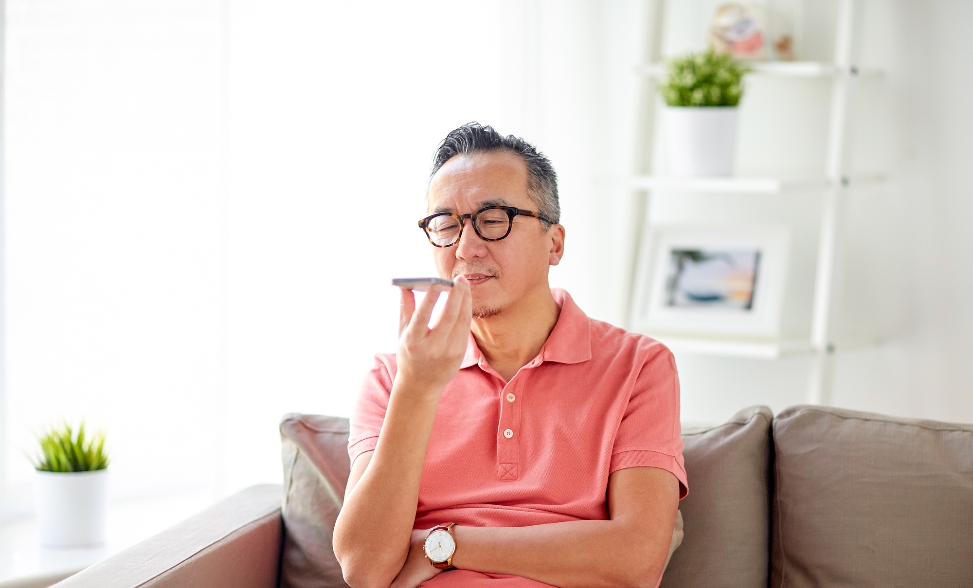 man using voice command recorder on smartphone