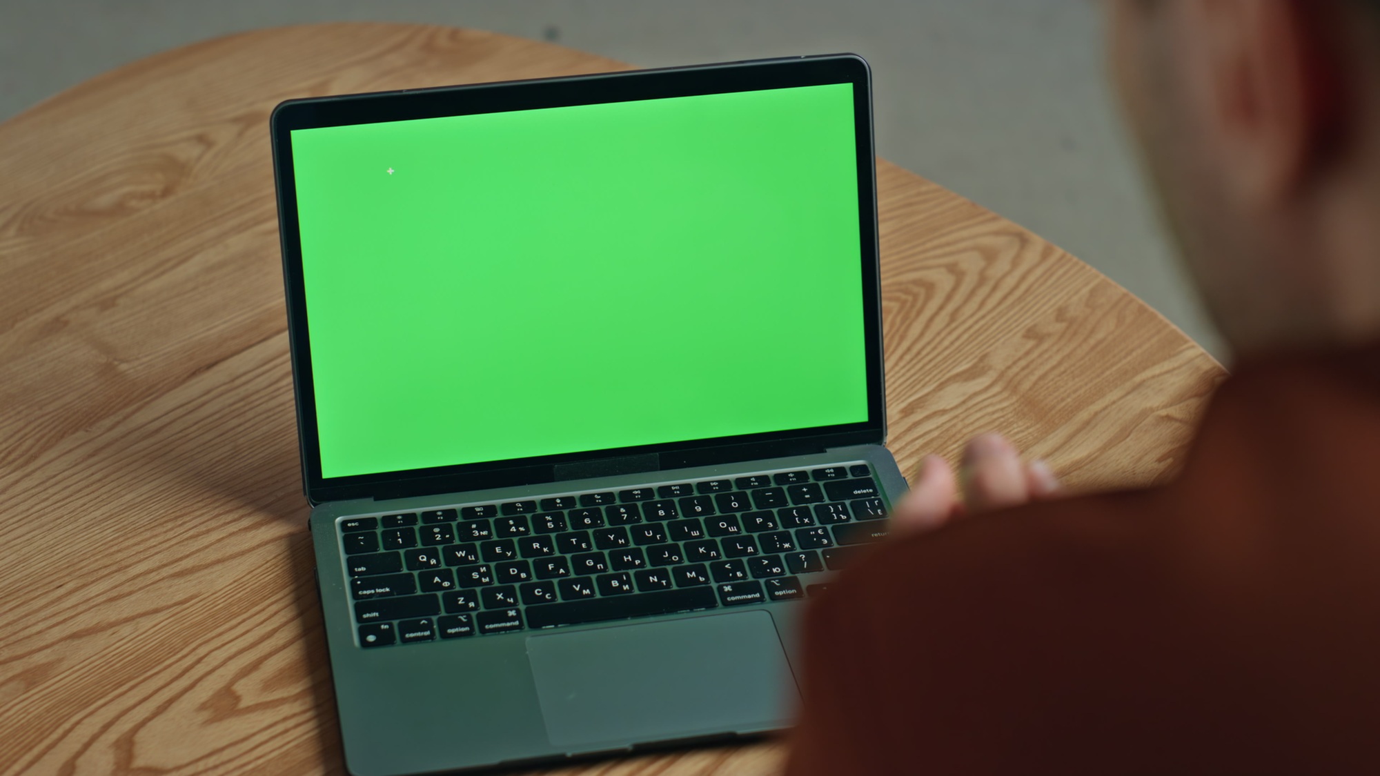 Man video calling greenscreen laptop gesturing home closeup. Businessman talking