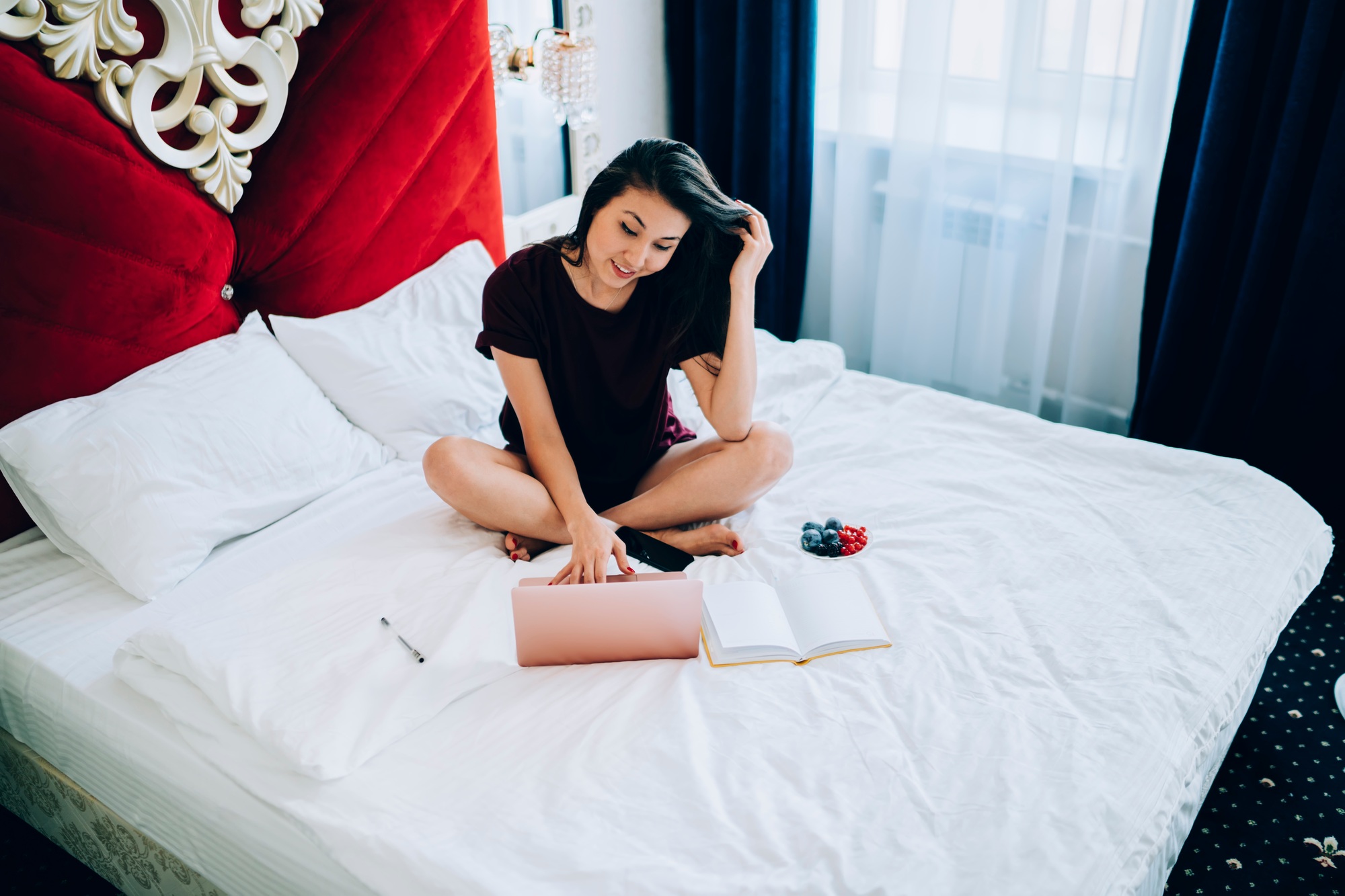 Millennial female blogger writing content text for sharing to social media via netbook