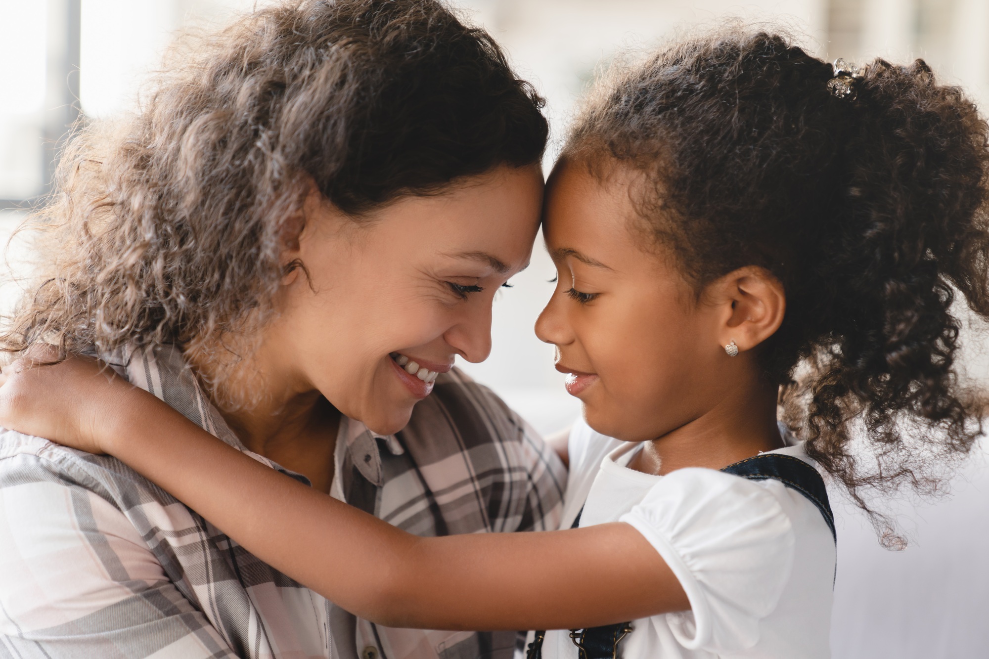 Mother and daughter hugging sharing love and care. Motherhood. Happy Mother`s day!