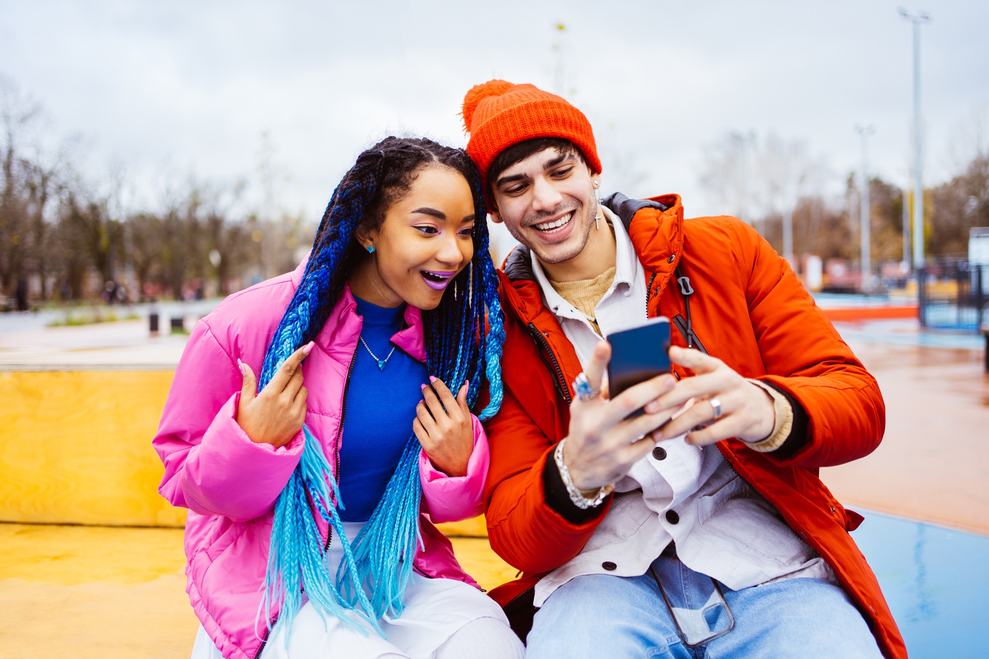 Multiracial young couple of lovers dating outdoors in winter