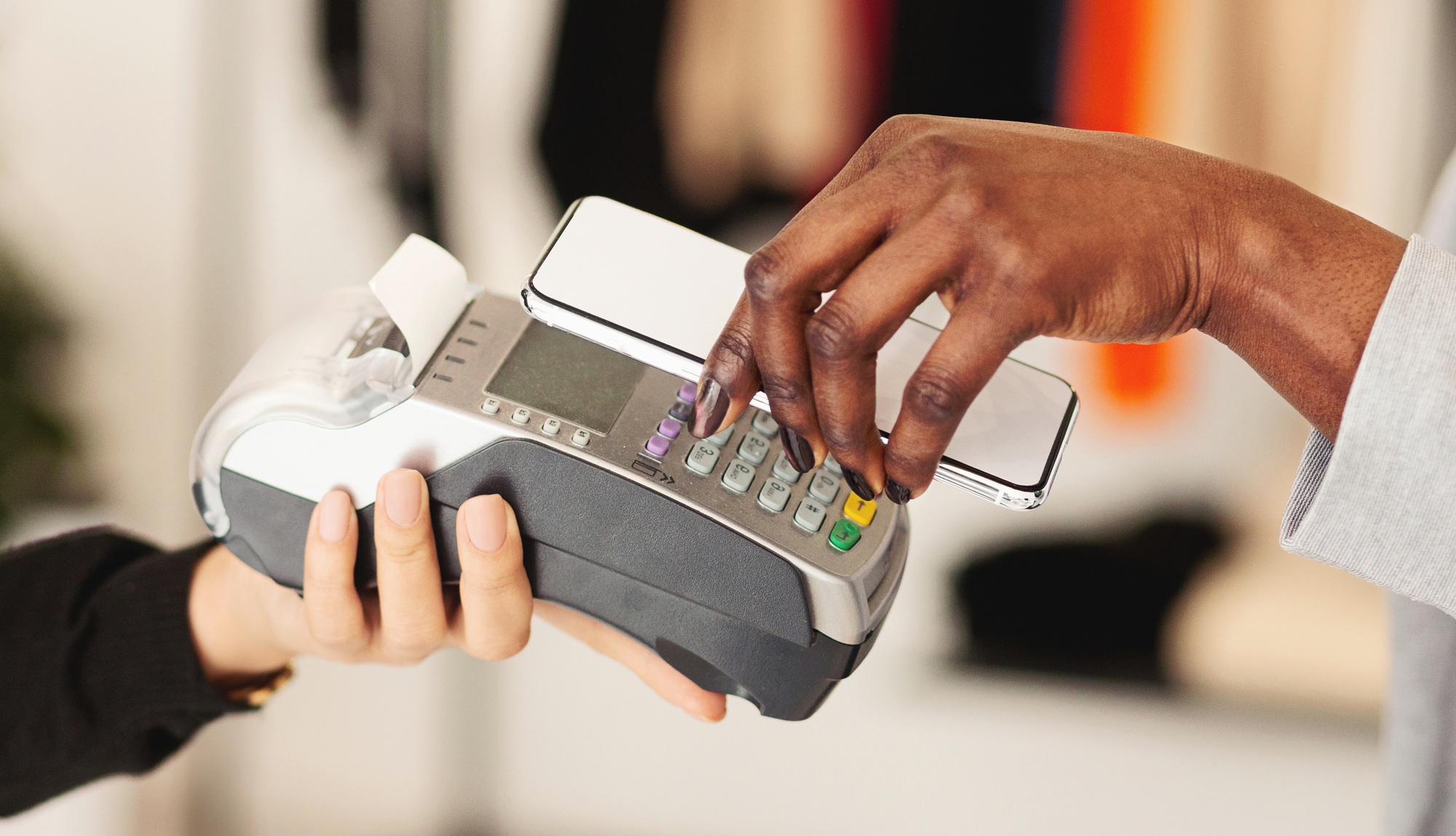 NFC technology. Woman making mobile payment with electronic reader