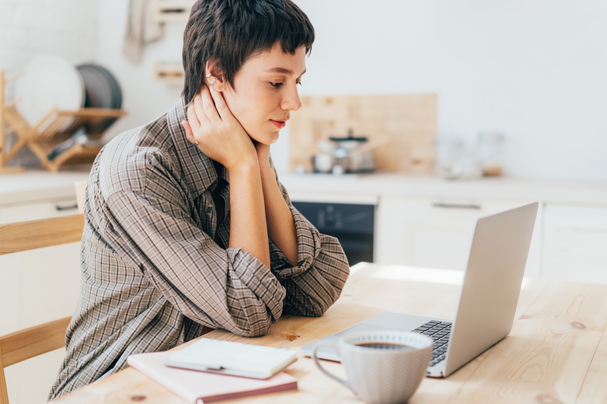 Online education, distance courses. A woman is studying using a laptop.
