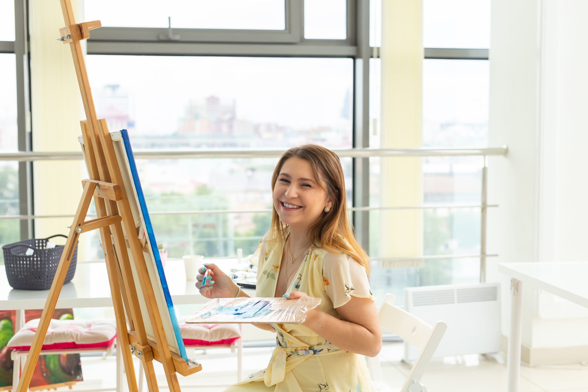 School of art, college of arts, education for group of young students. Happy young woman smiling
