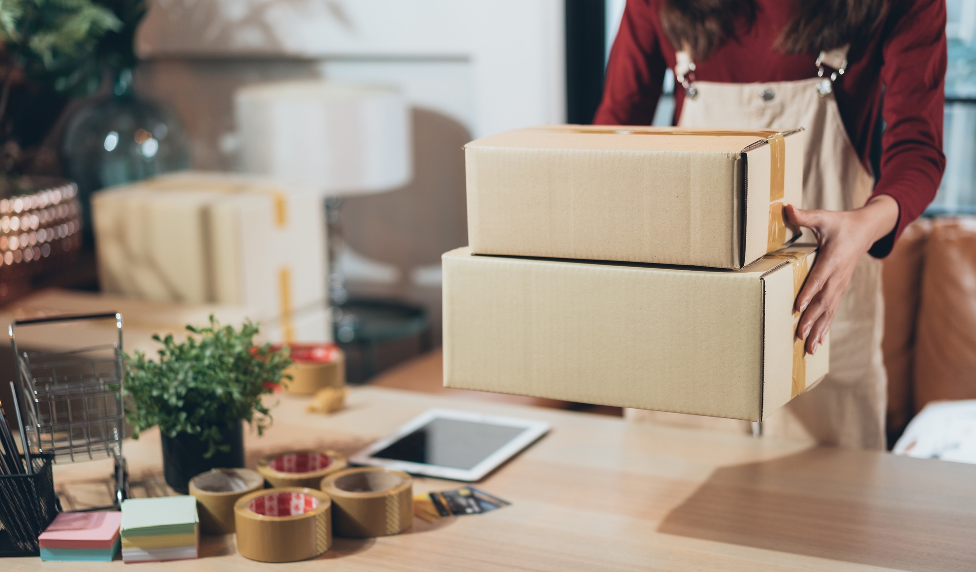 Small business shop owner carry boxes preparing to delivery