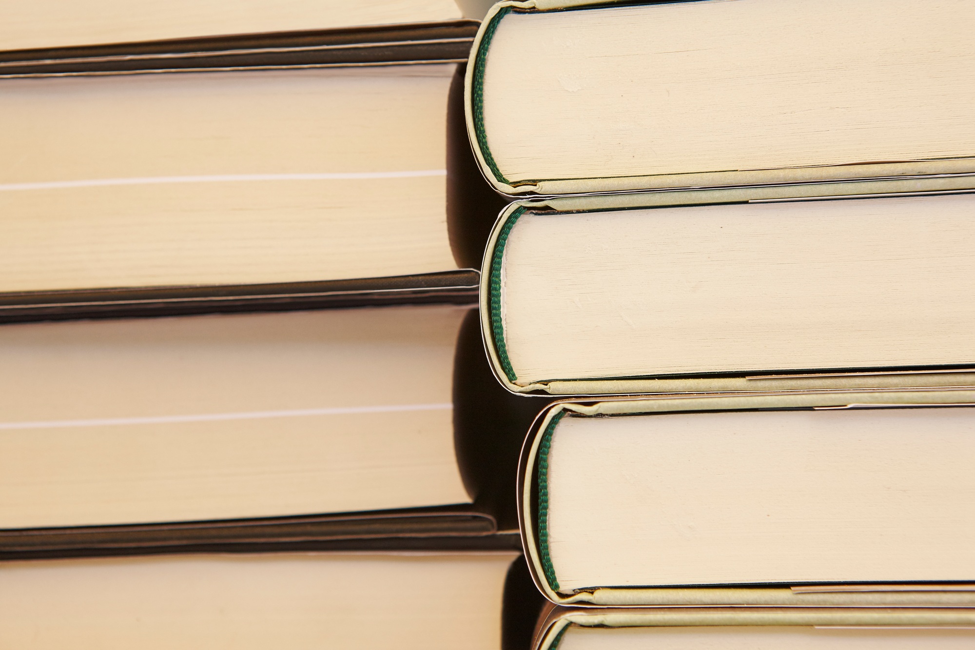 Stacked books. Educational and learning background. School items. Horizontal