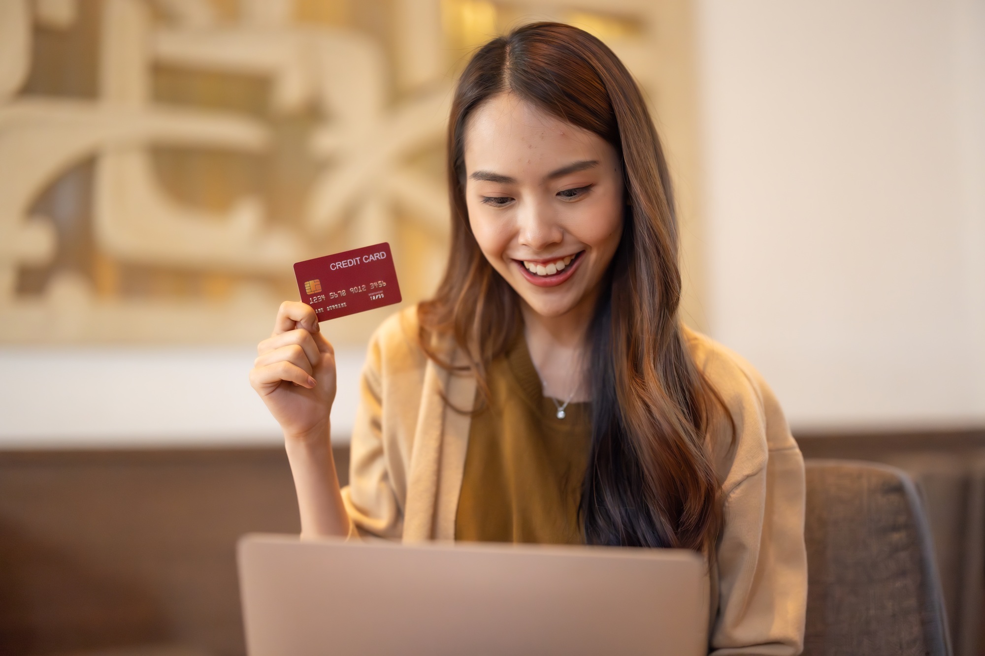 Stylish young women shop online using cards, bitcoin. Enjoy loyalty discounts coupons, fast shipping